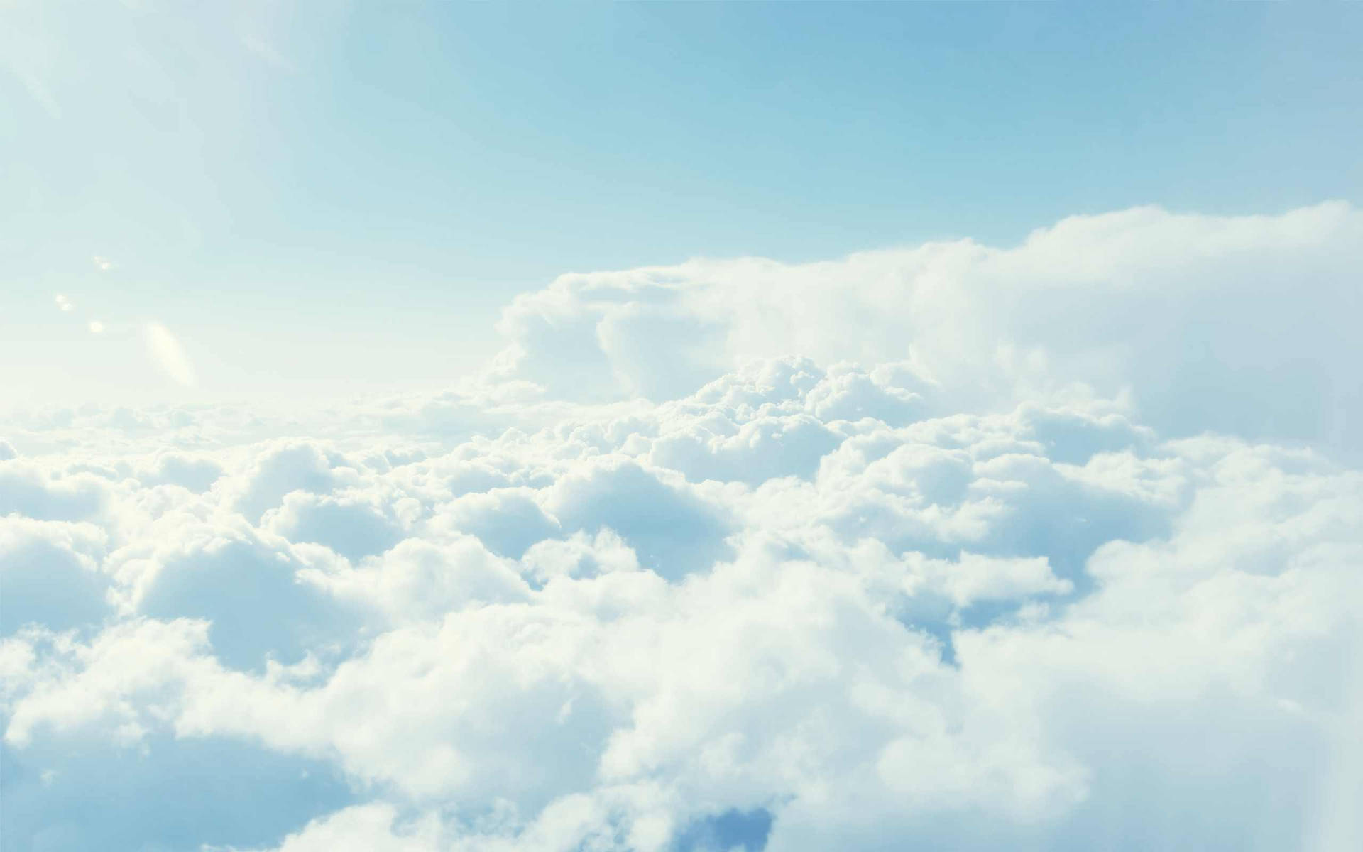 A View Of Clouds From An Airplane Background