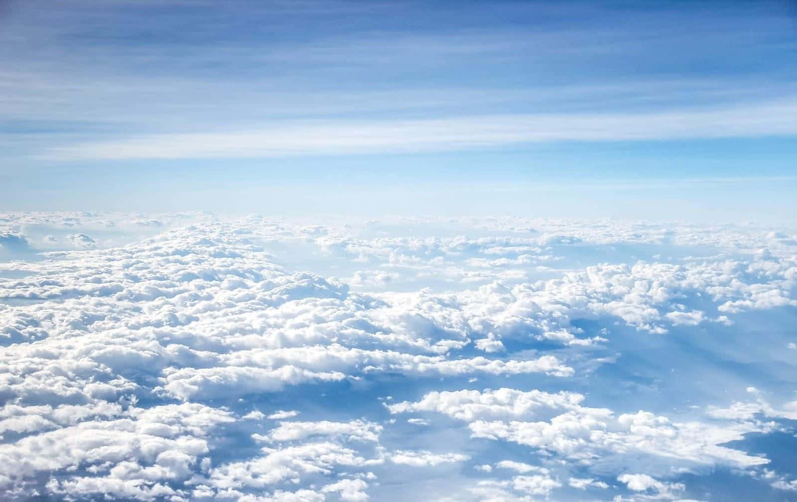 A View Of Clouds From An Airplane Window Background