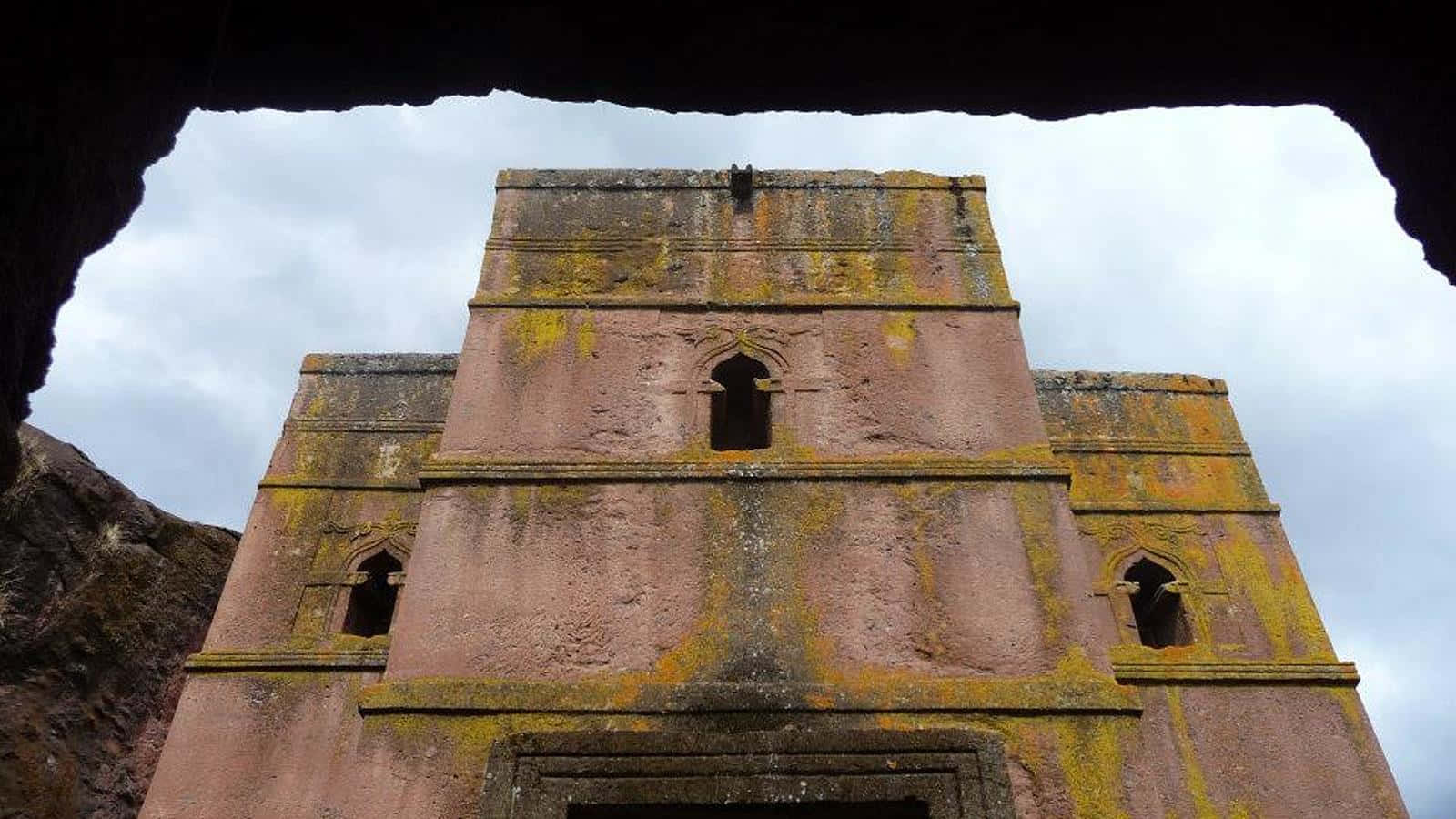 A View Of Lalibela's St. George Church From A Cave Background