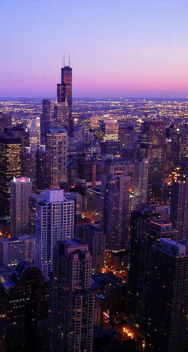 A View Of The Chicago Skyline At Dusk Background