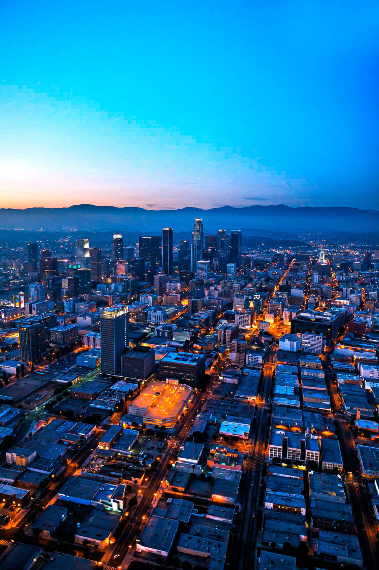 A View Of The City At Dusk Background
