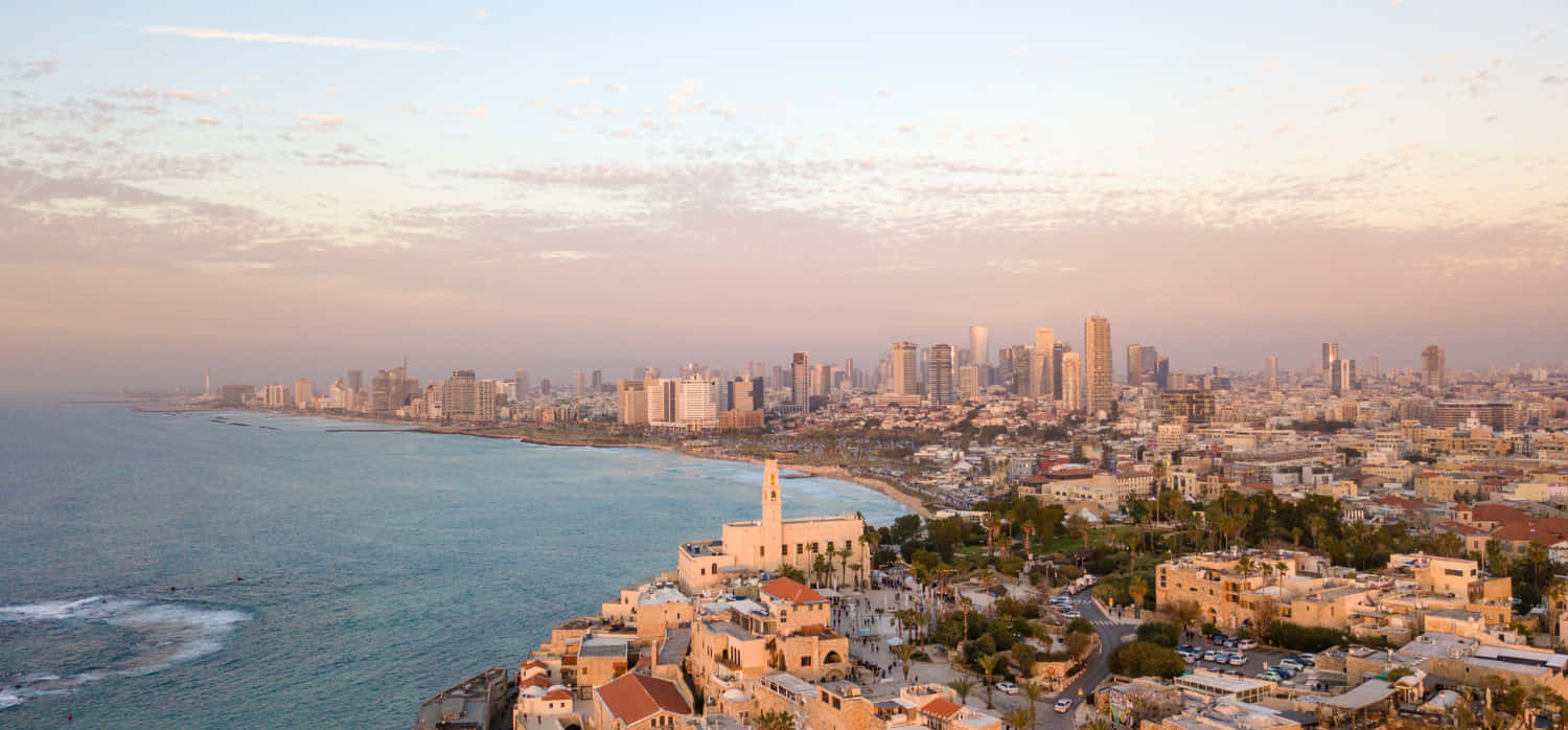 A View Of The City Of Tel Aviv And The Sea Background