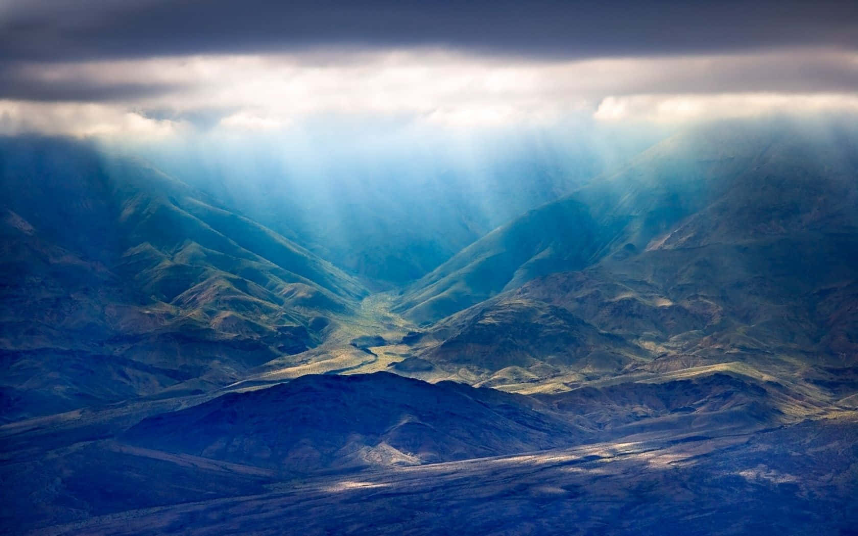 A View Of The Mountains From An Airplane