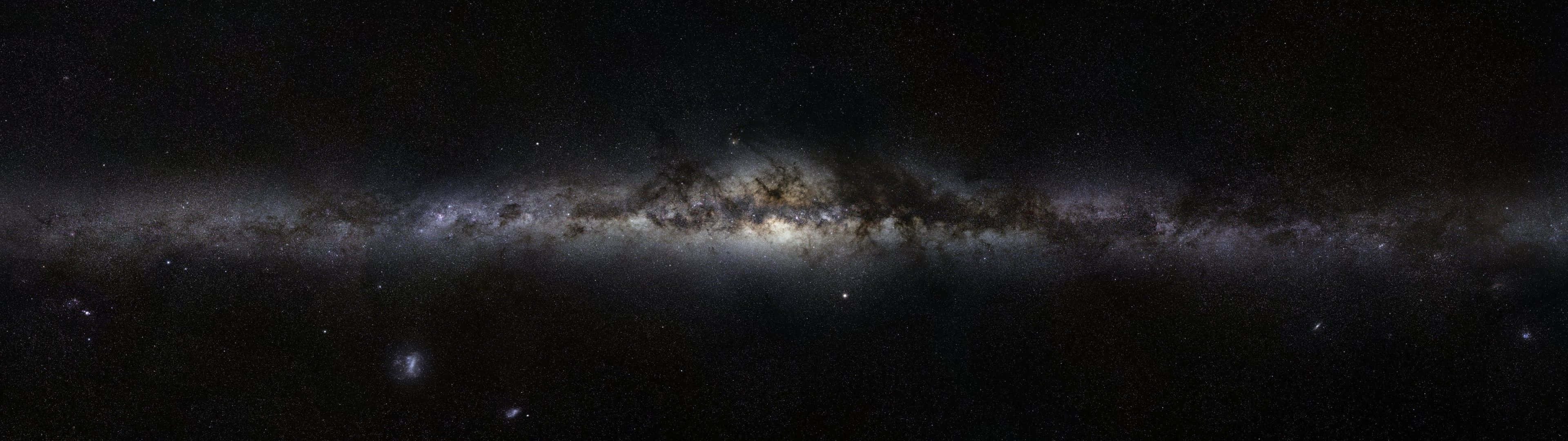 A View Of The Night Sky From The Edge Of A Cliff