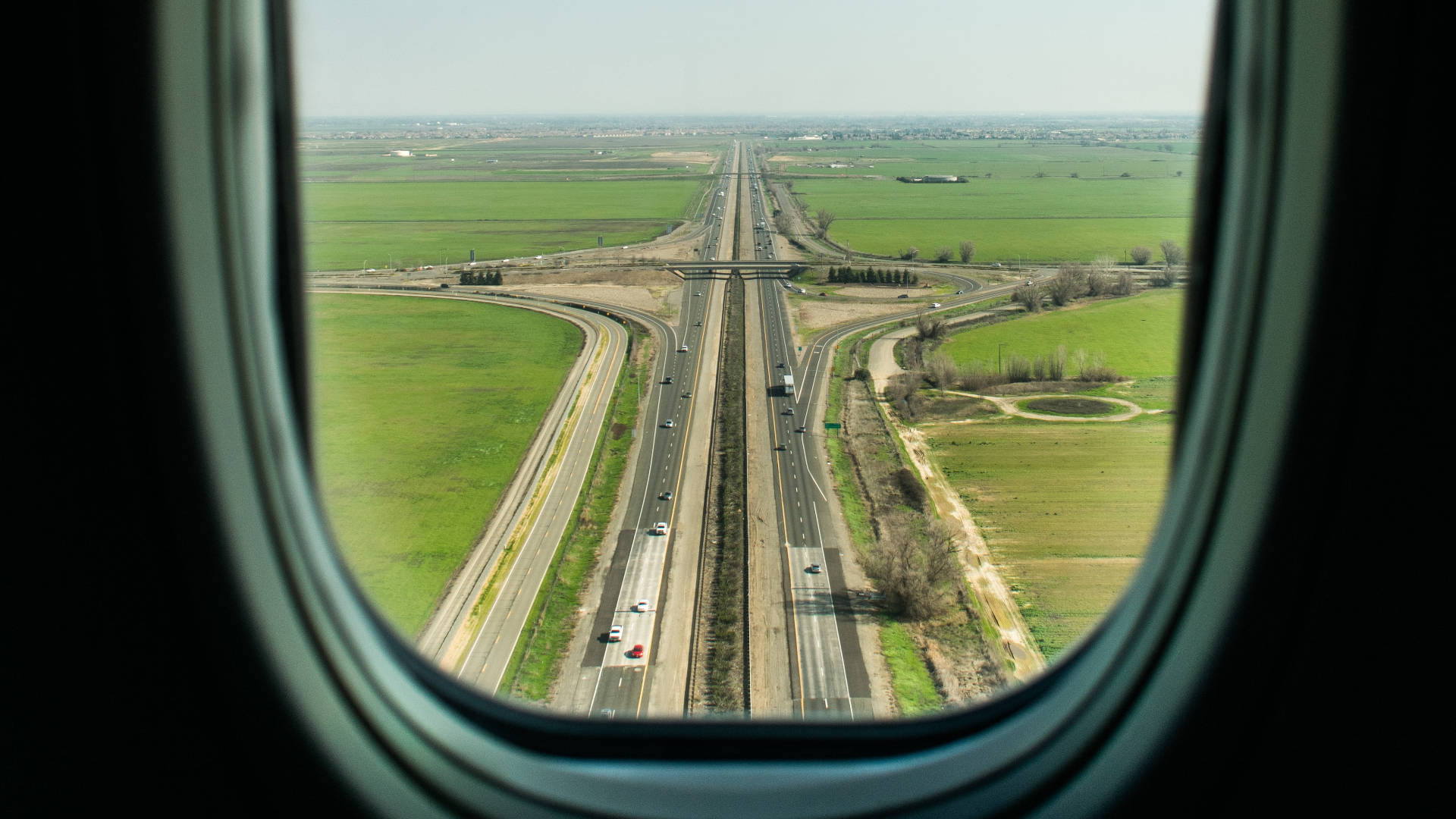 A View Of The Runway From A Plane Window Background