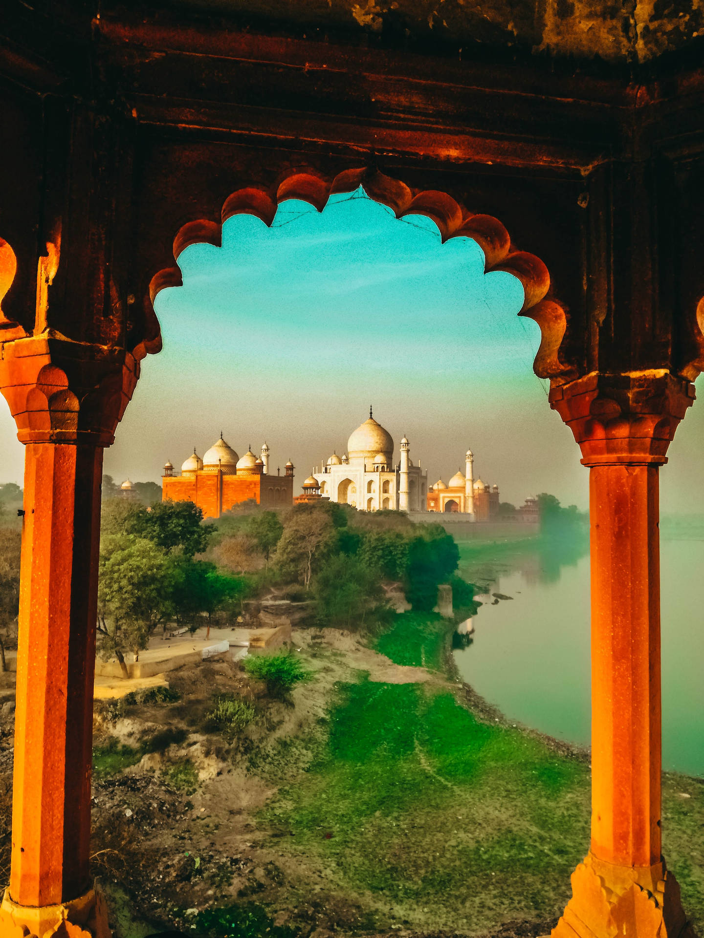 A View Of The Taj Mahal From A Hill Background