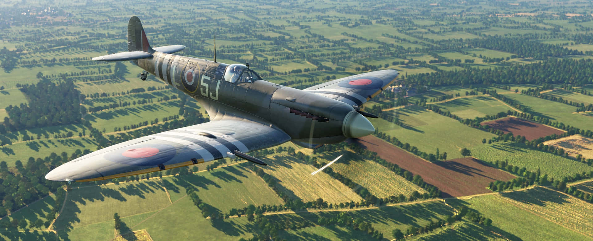 A Vintage Fighter Plane Flying Over A Field Background