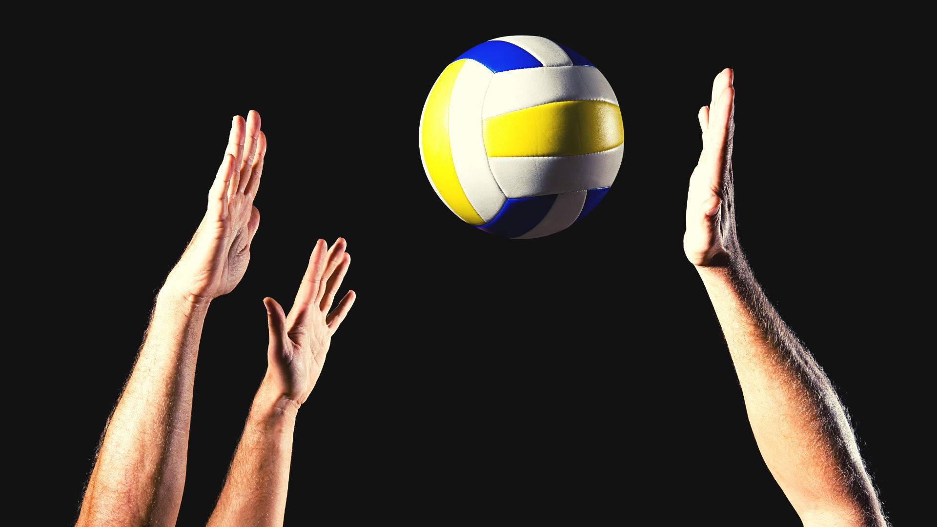 A Volleyball Ball Is In The Hands Of Two People