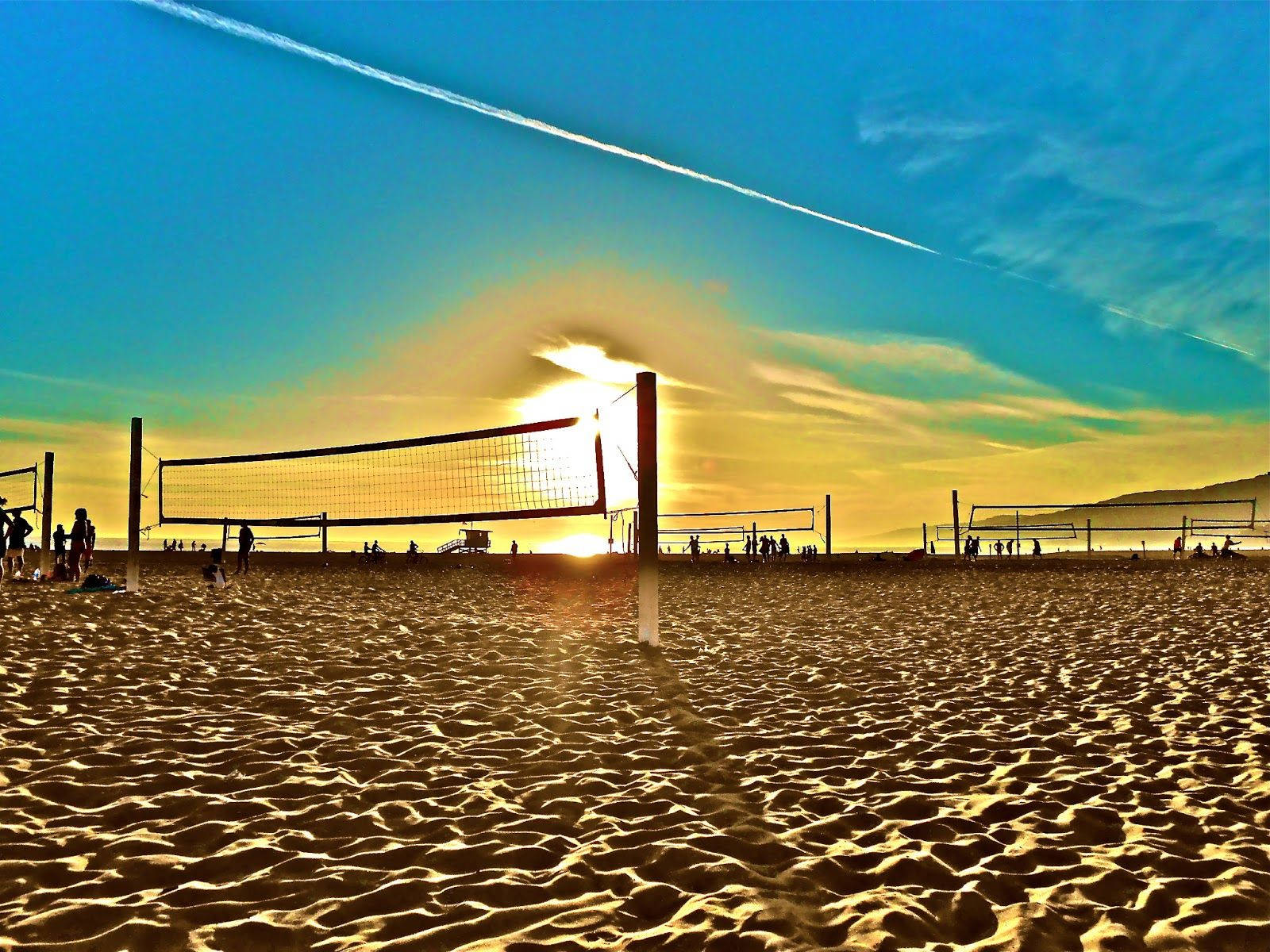 A Volleyball Net On The Beach Background