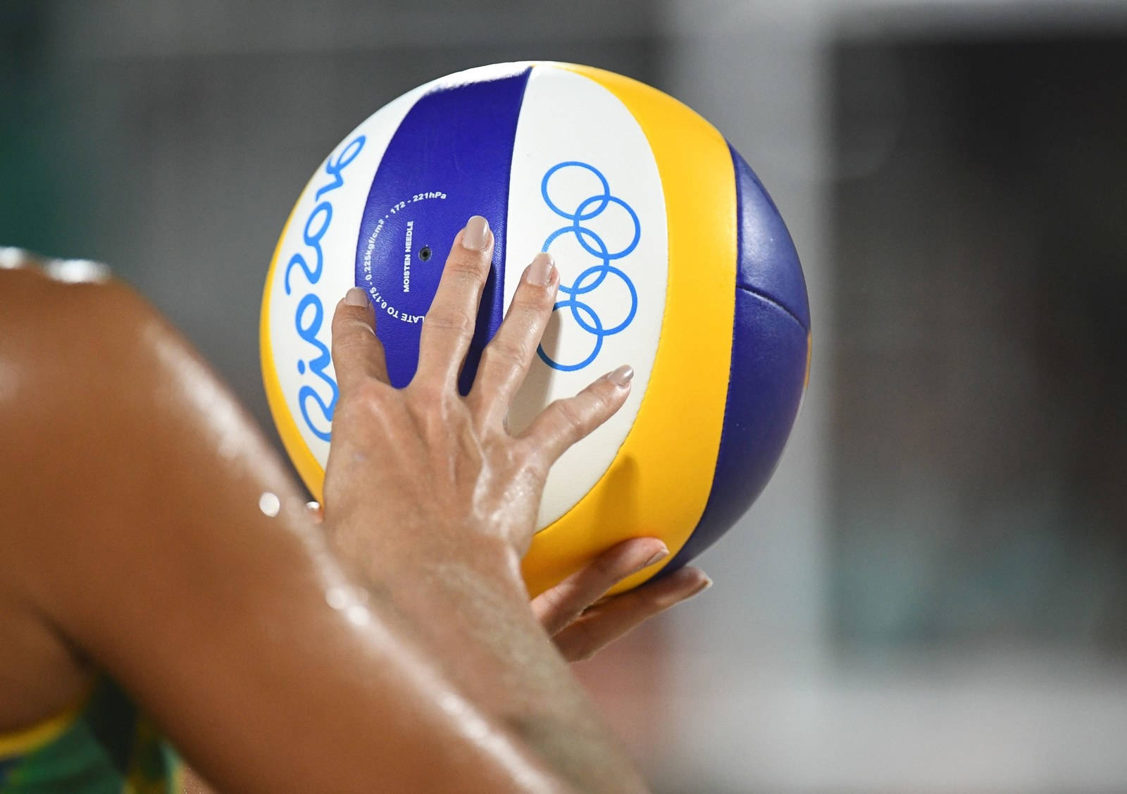 A Volleyball Player Enjoys A Match On Their Laptop Background