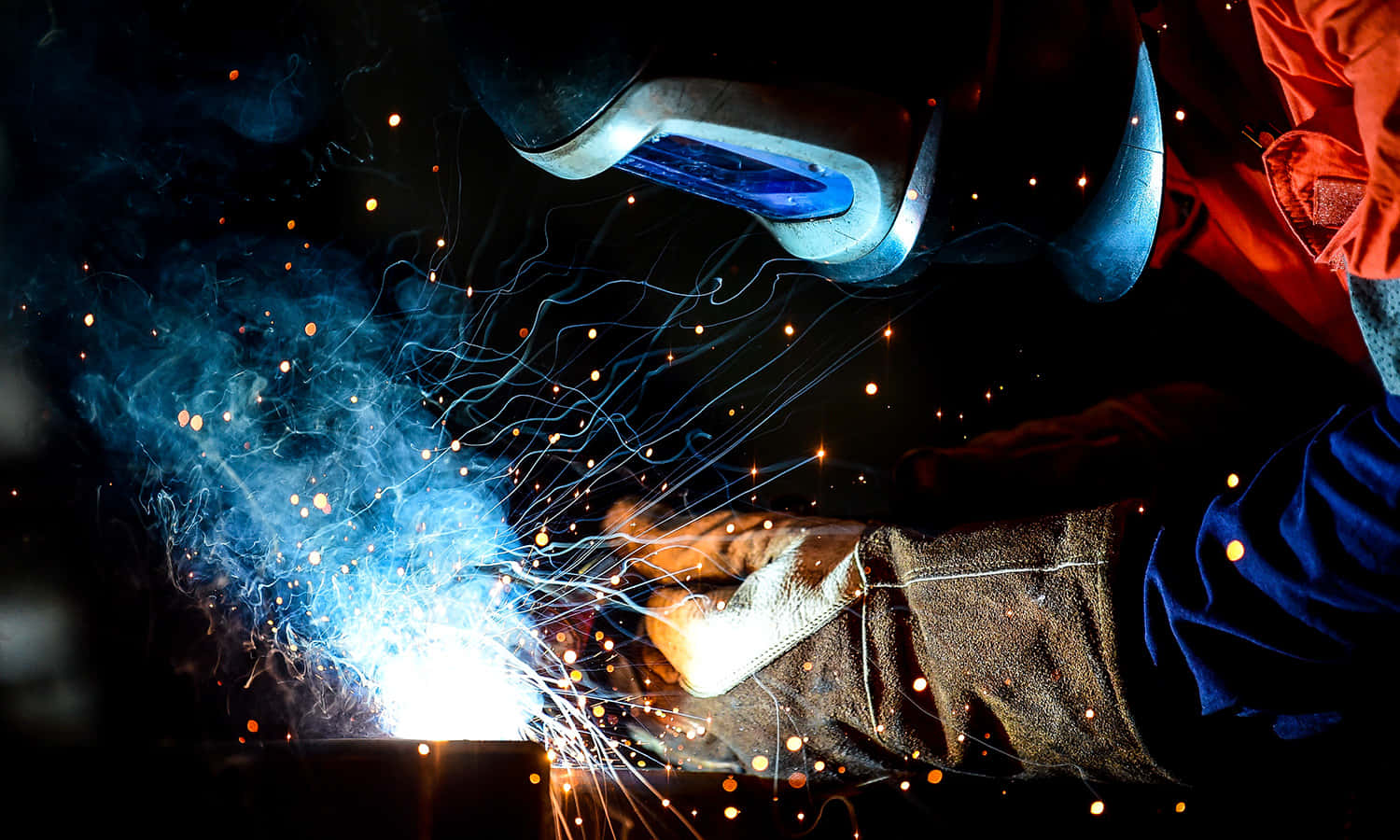 A Welder Is Welding Background