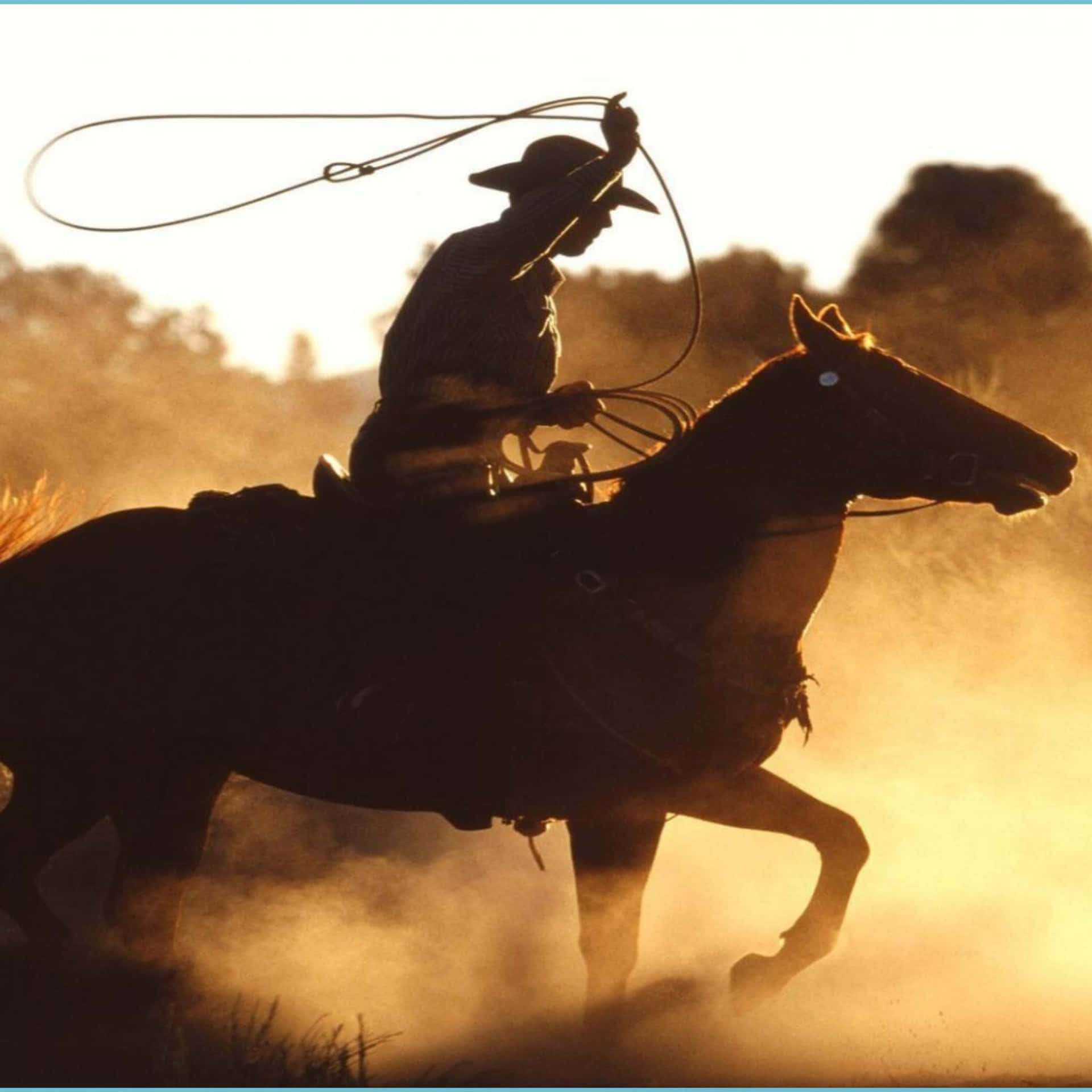 A Western Cowboy With His Trusty Horse Against A Sunset Backdrop Background