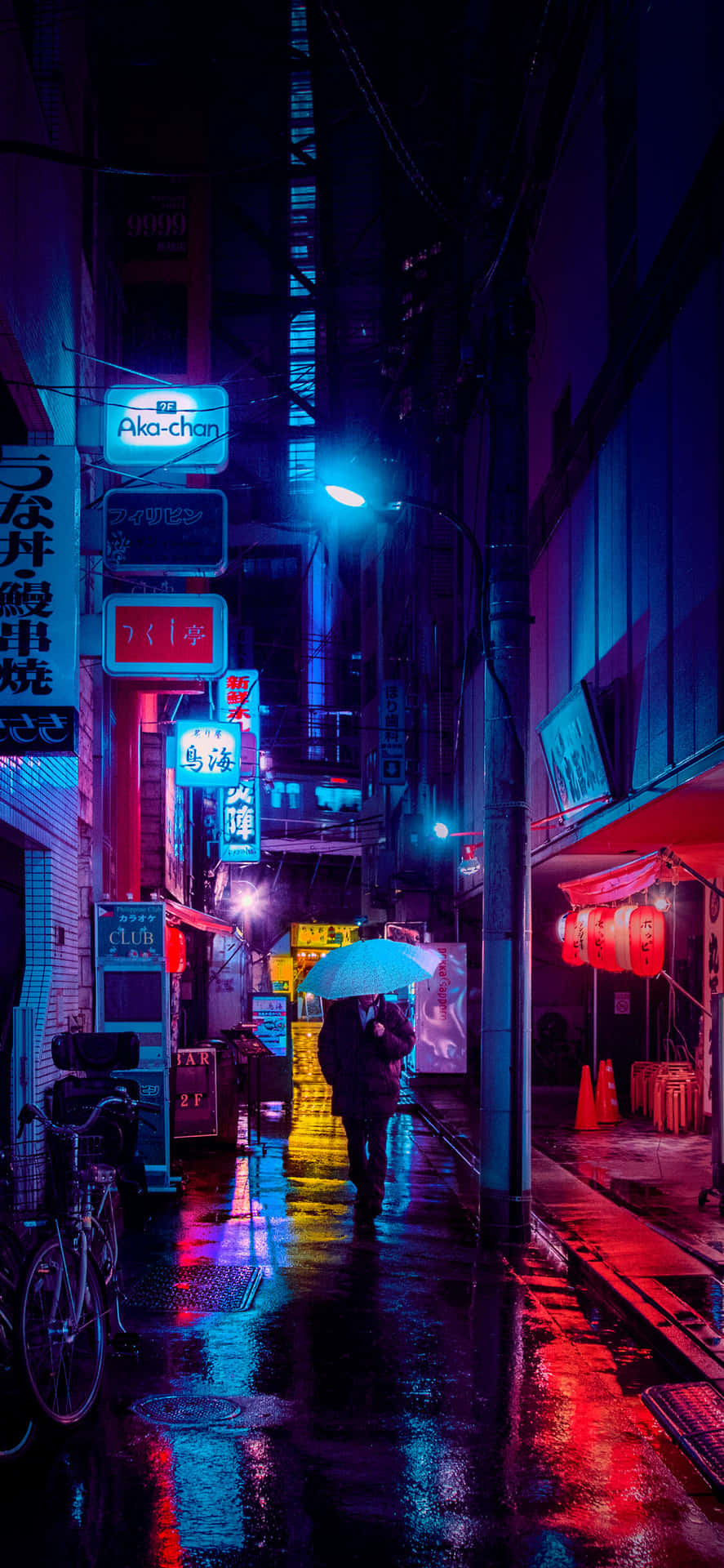 A Wet Street With A Lot Of Neon Lights Background