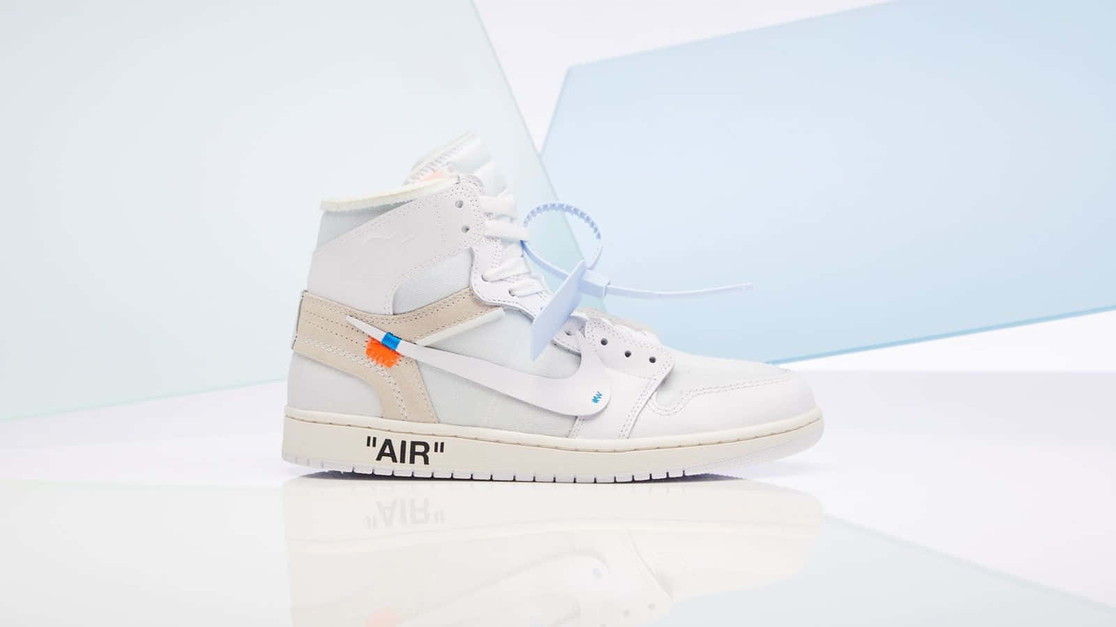 A White And Blue Nike Jordan 1 High Is On A White Surface Background