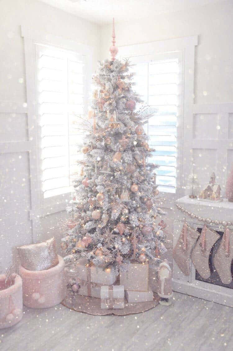 A White And Pink Christmas Tree In A Room Background