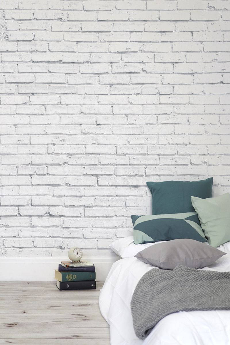 A White Brick Wall In A Bedroom