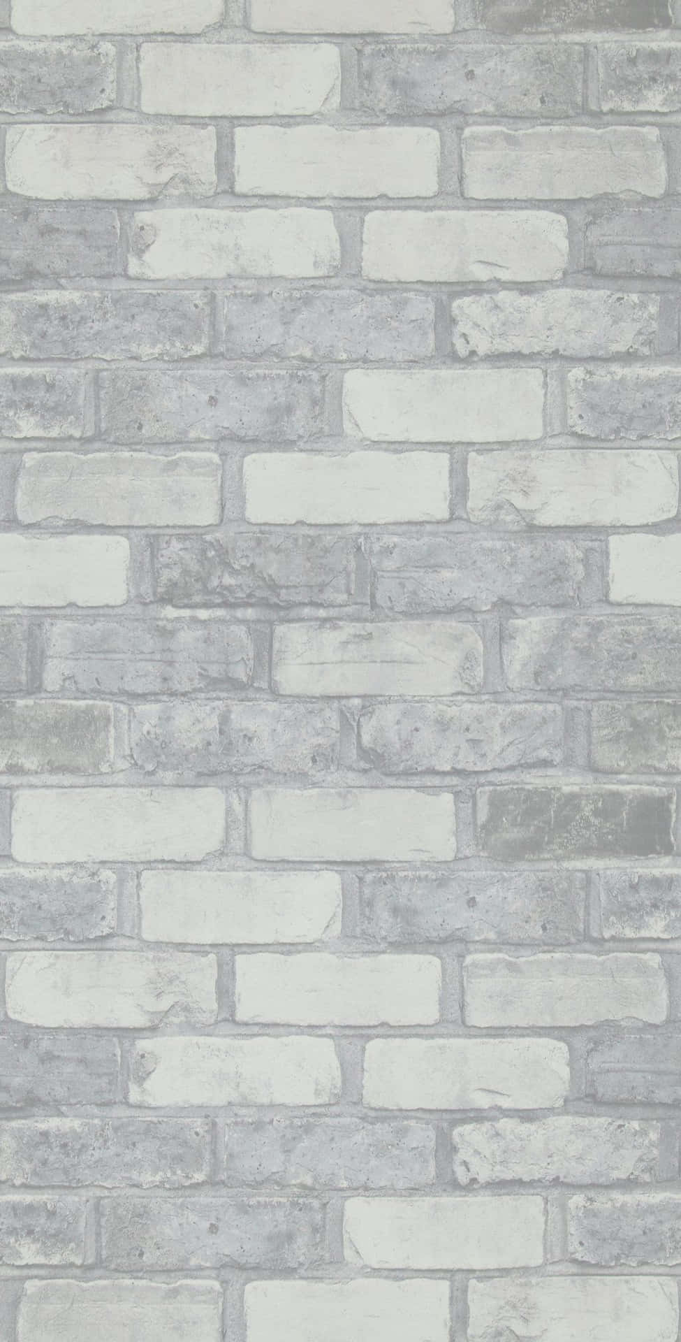 A White Brick Wall With Gray And White Bricks Background