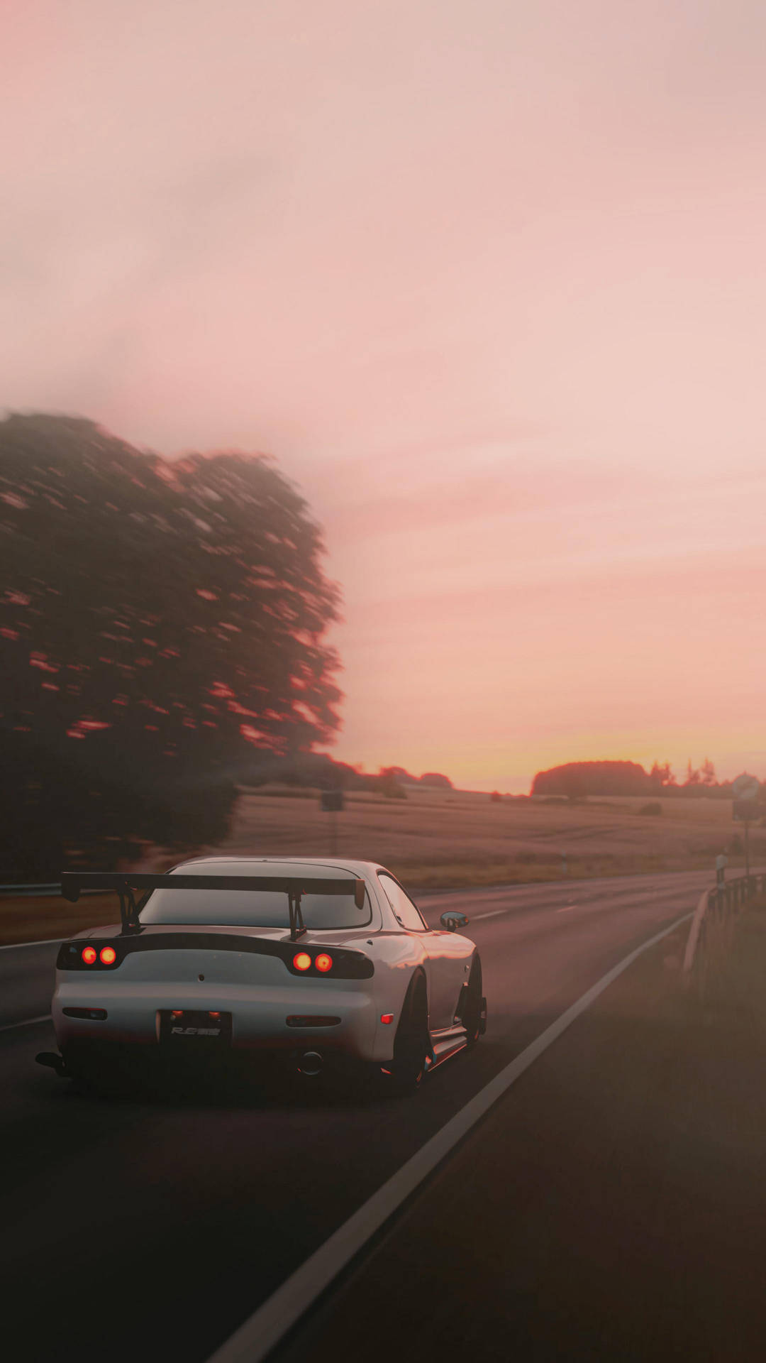 A White Car Driving Down A Road Background