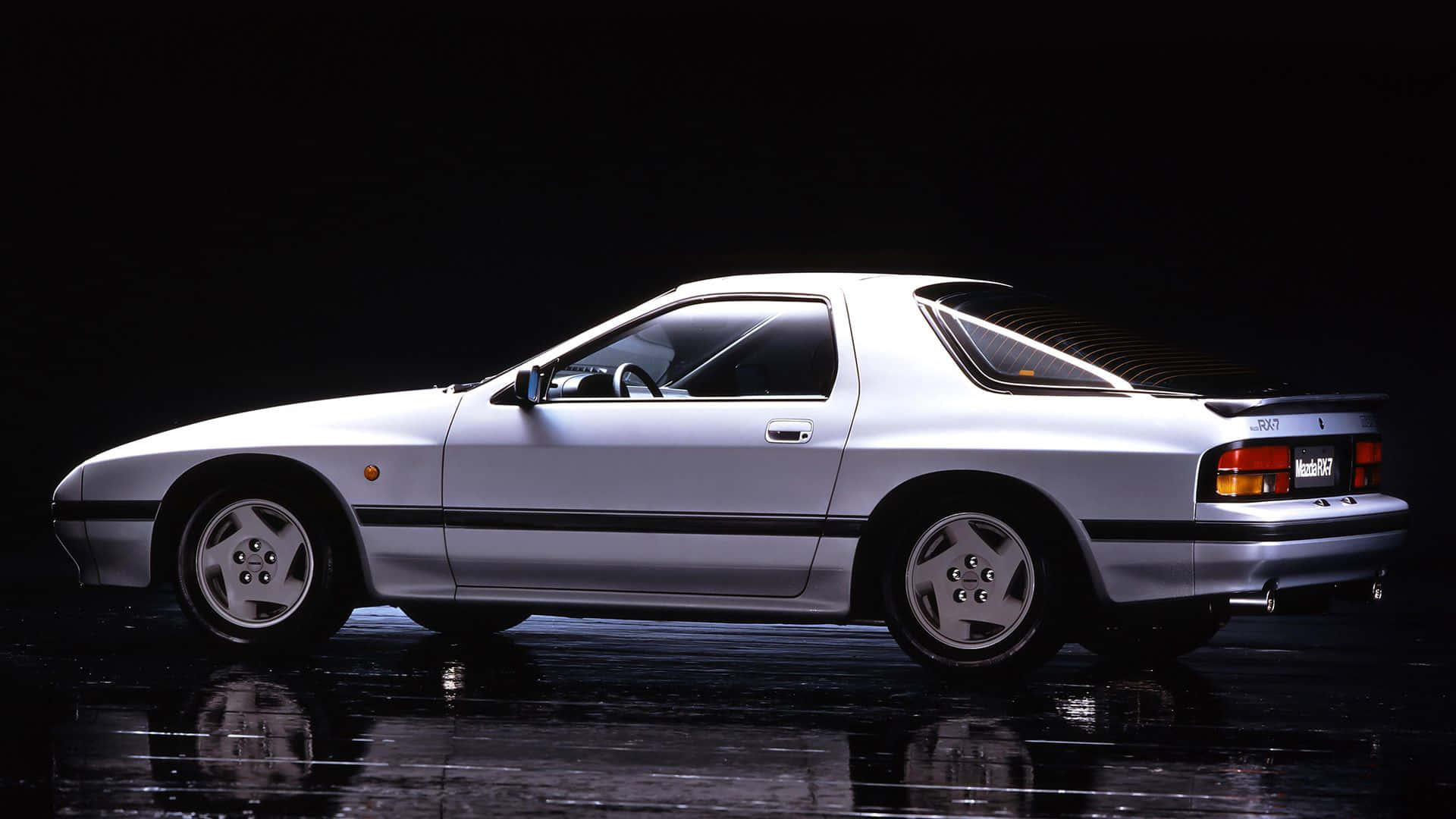 A White Car In A Dark Room