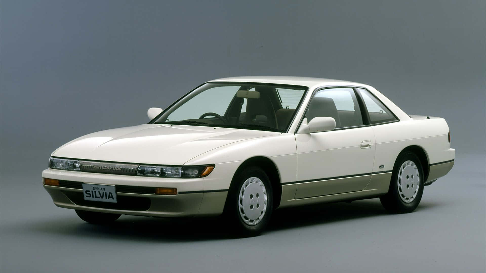 A White Car Is Shown On A Gray Background Background