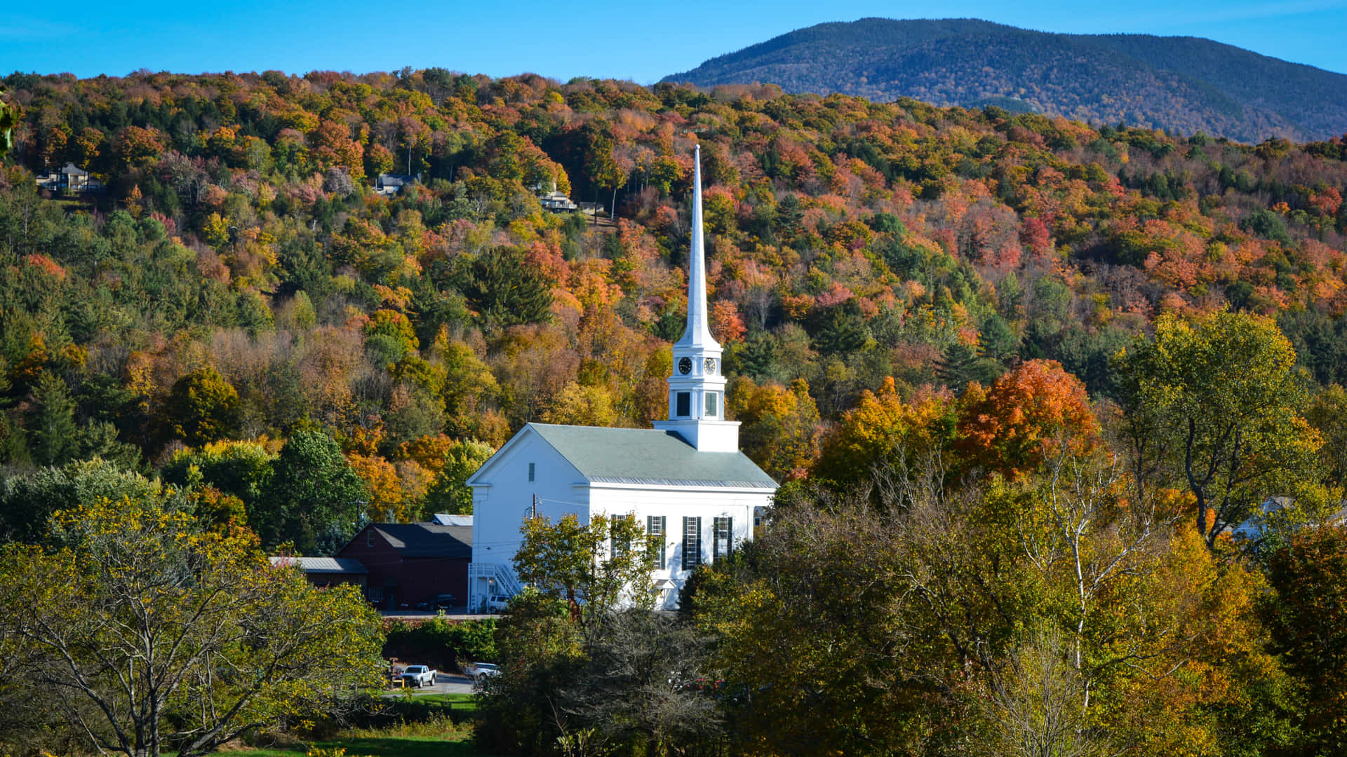 A White Church In The Fall Background