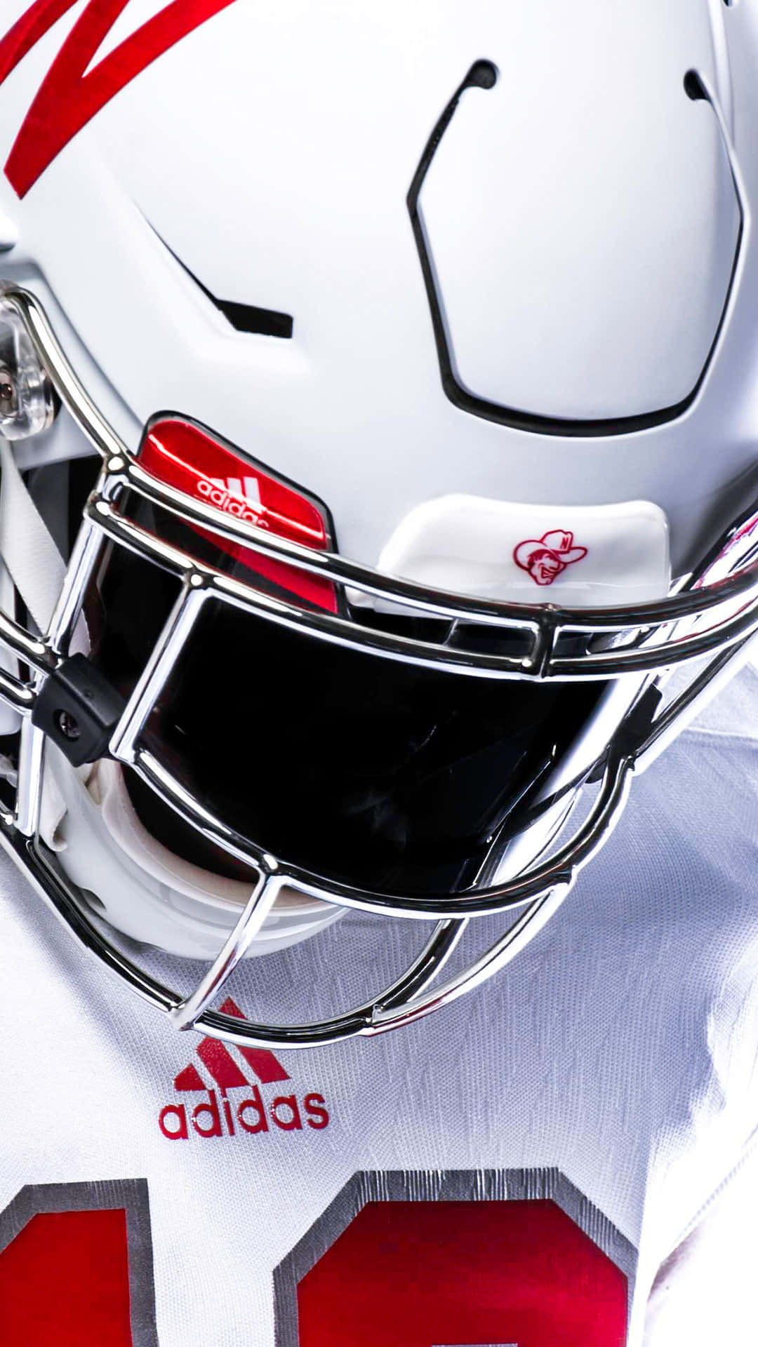 A White Football Helmet With Red Stripes Background