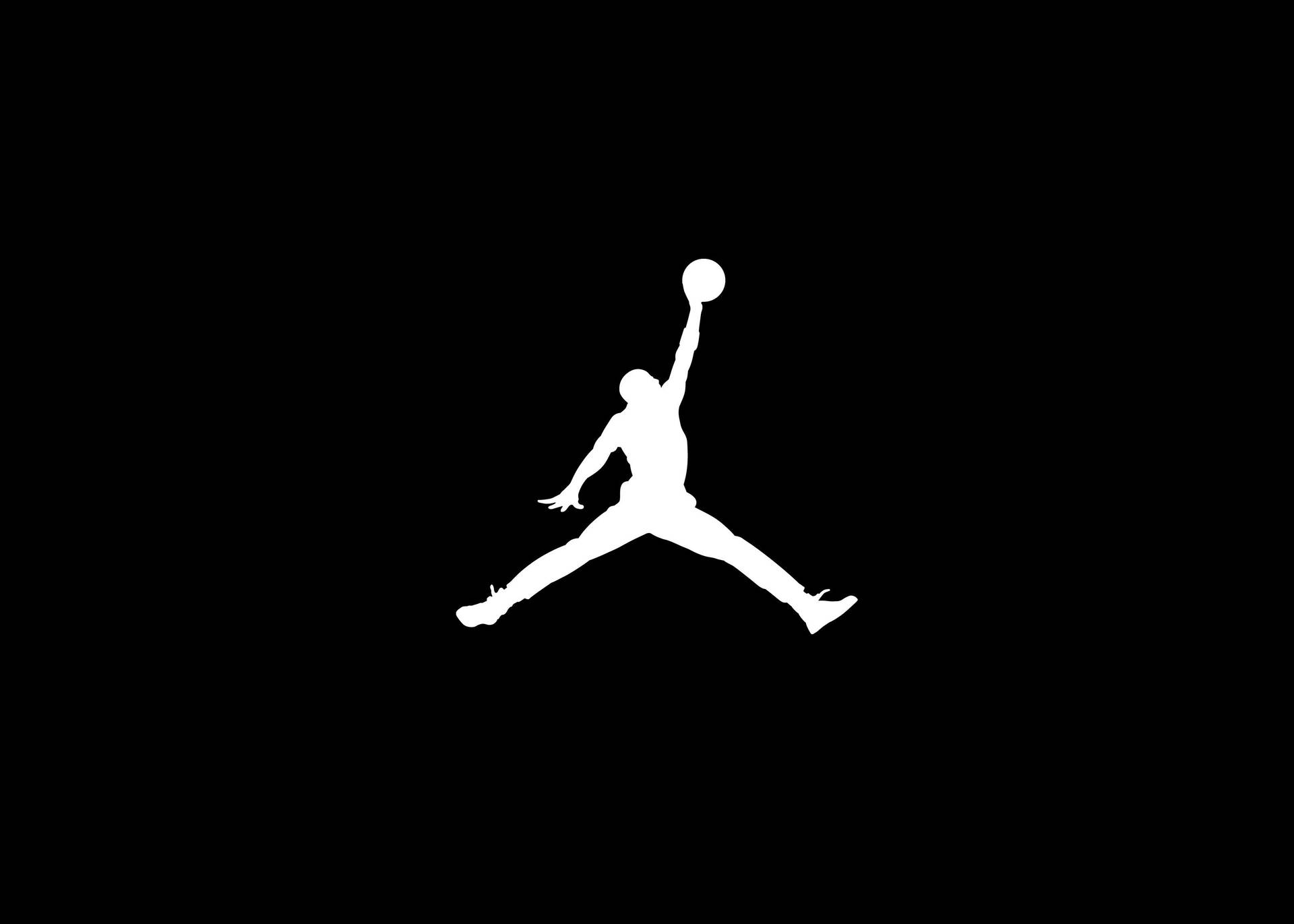 A White Jordan Logo On A Black Background Background