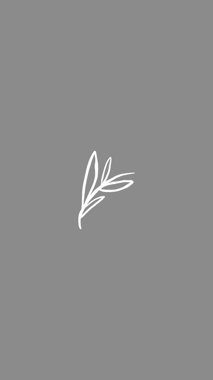 A White Leaf Logo On A Gray Background Background