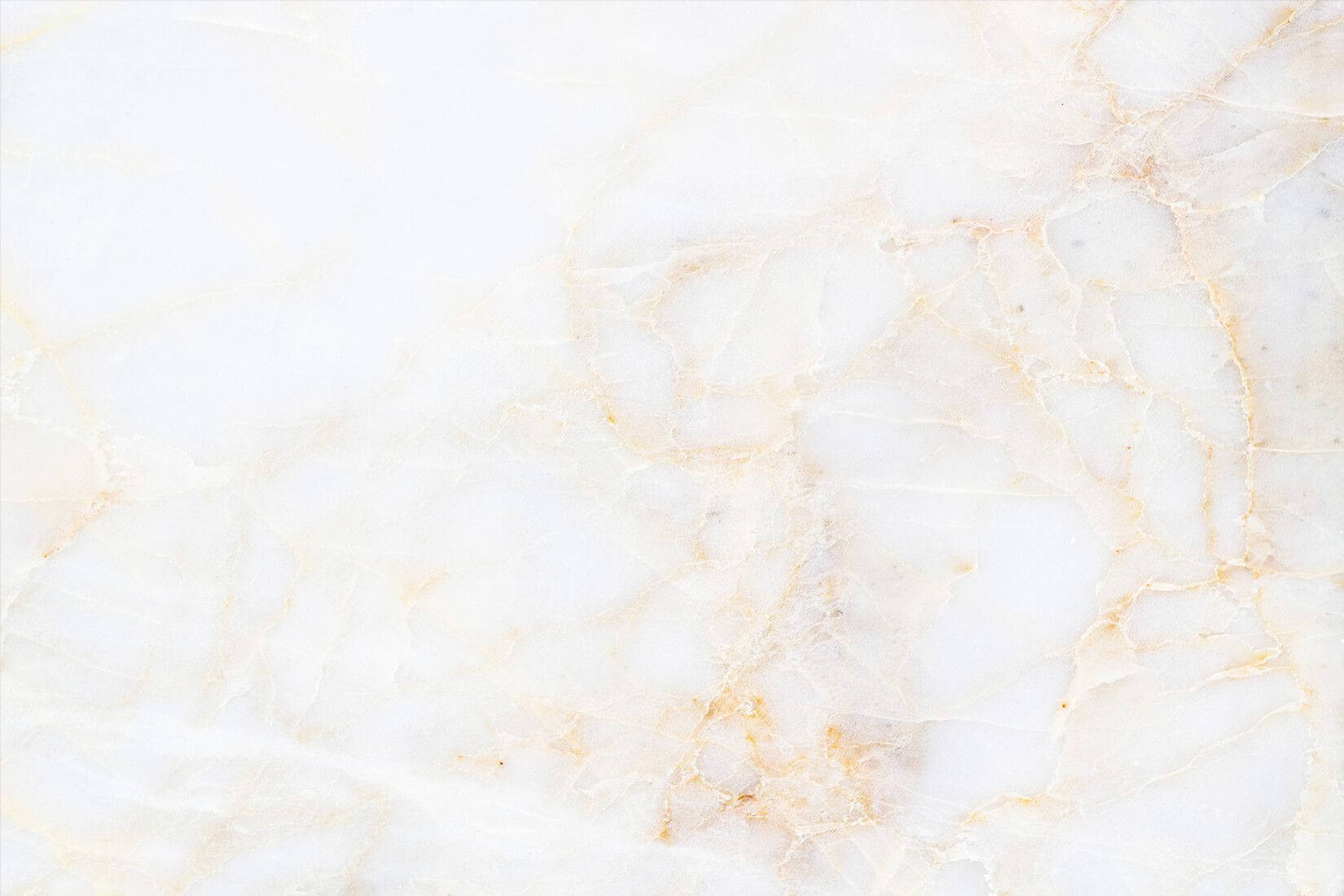 A White Marble Background With Gold And Yellow Background