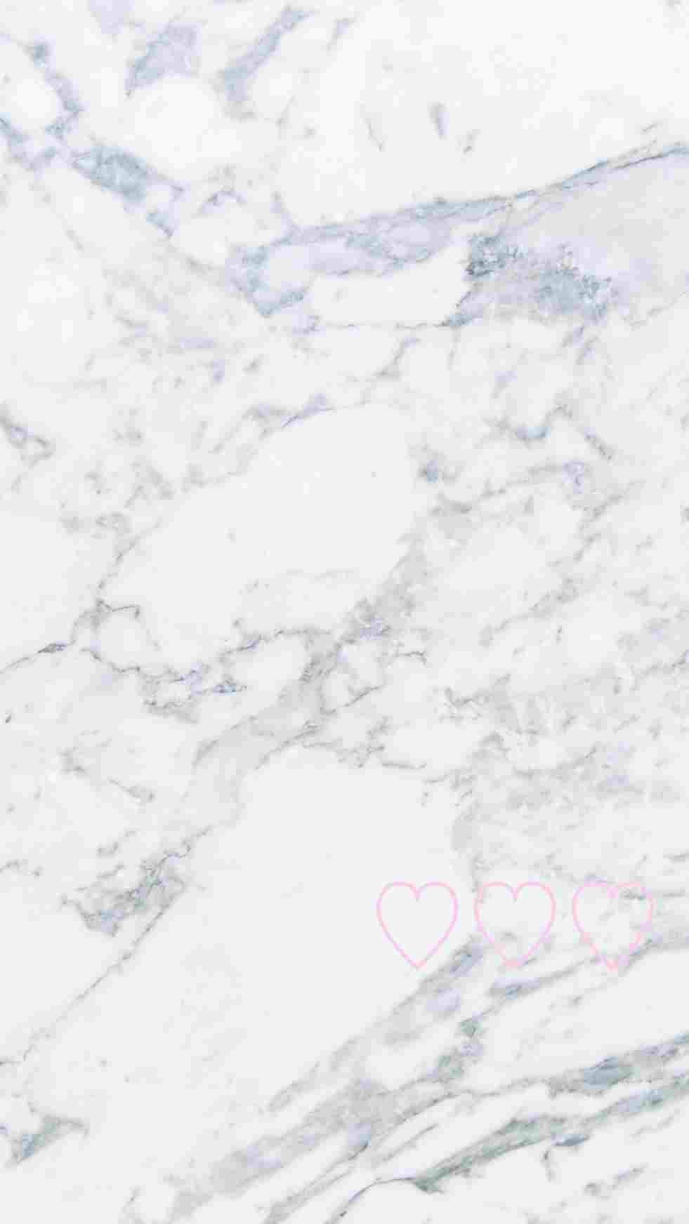 A White Marble Background With Pink Hearts On It Background