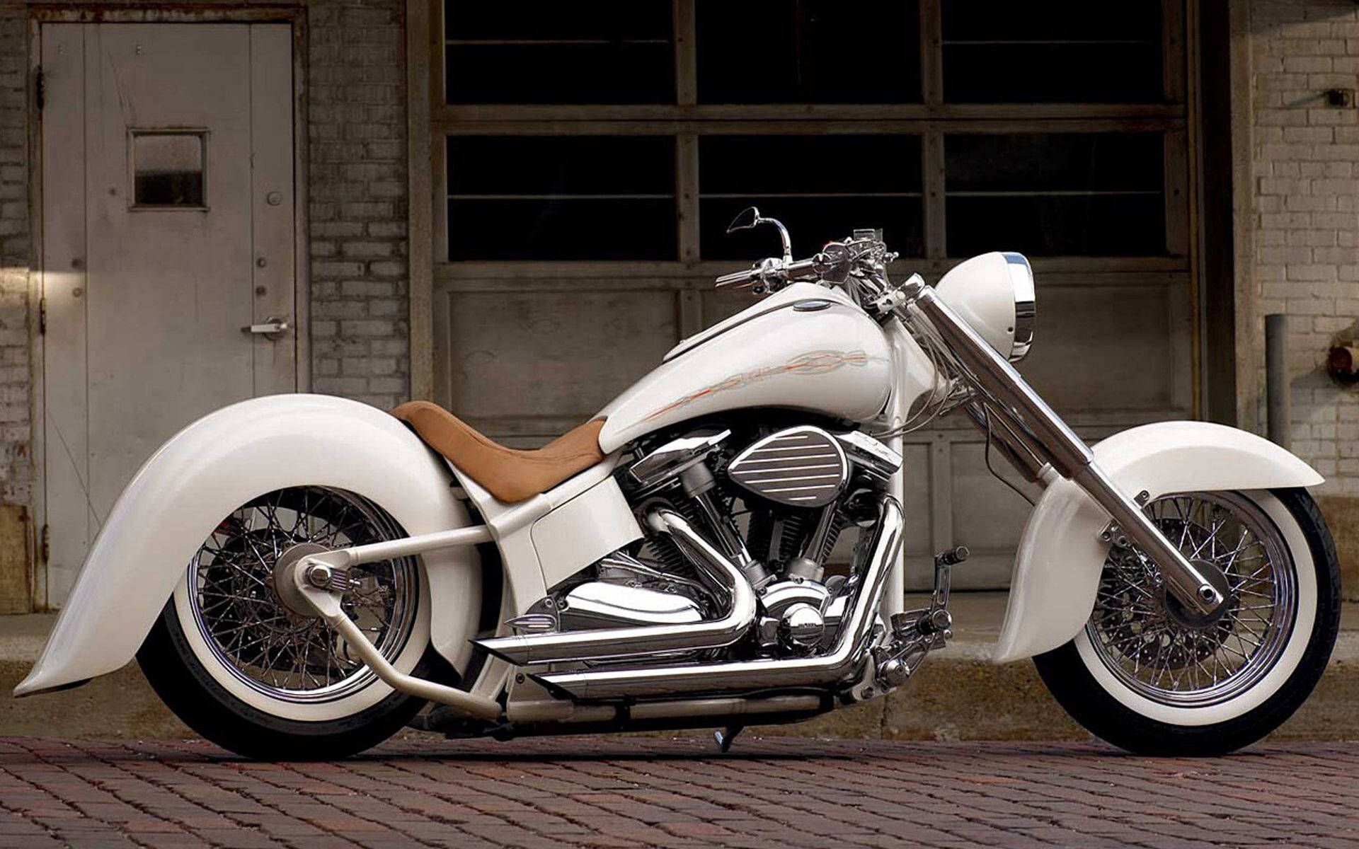 A White Motorcycle Parked On A Brick Sidewalk Background