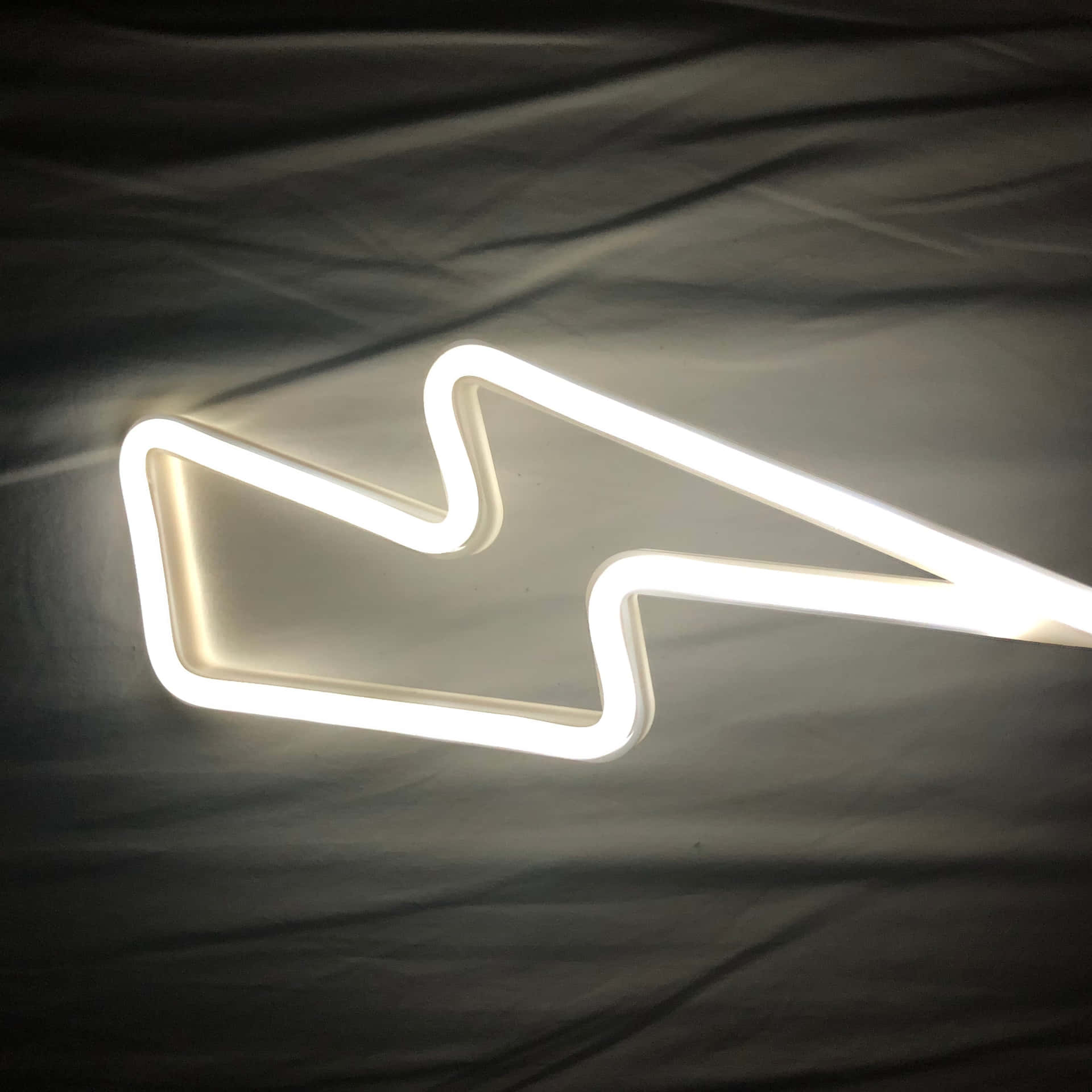 A White Neon Sign With A Lightning Bolt On It Background