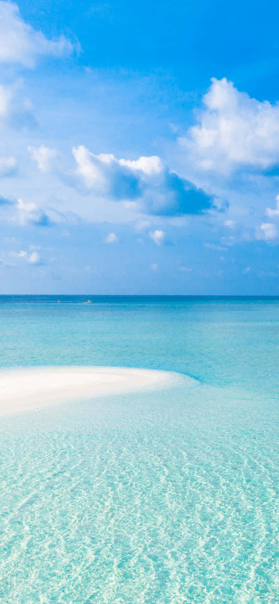 A White Sandy Beach With Clear Water