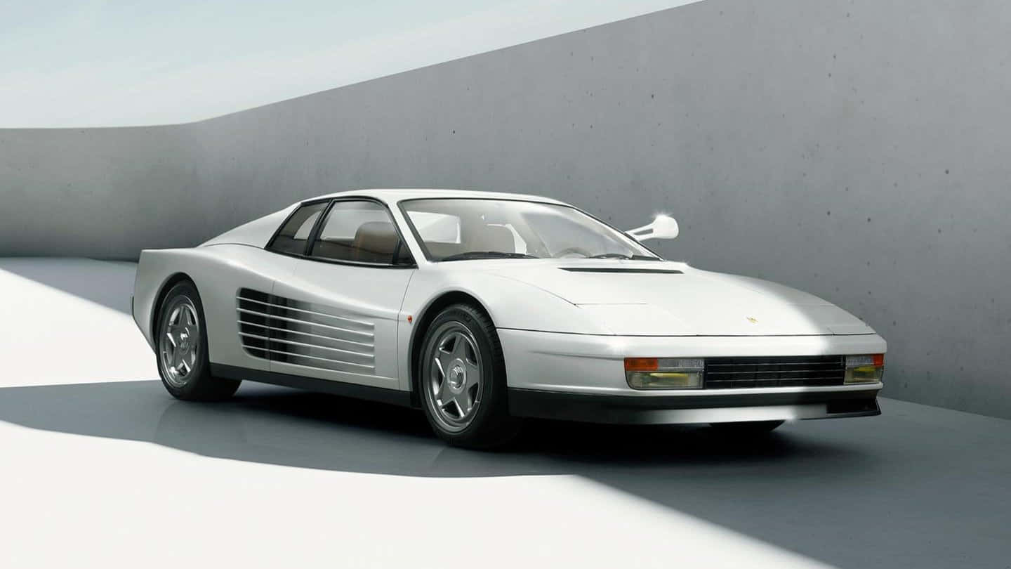 A White Sports Car Is Parked In A Concrete Area Background