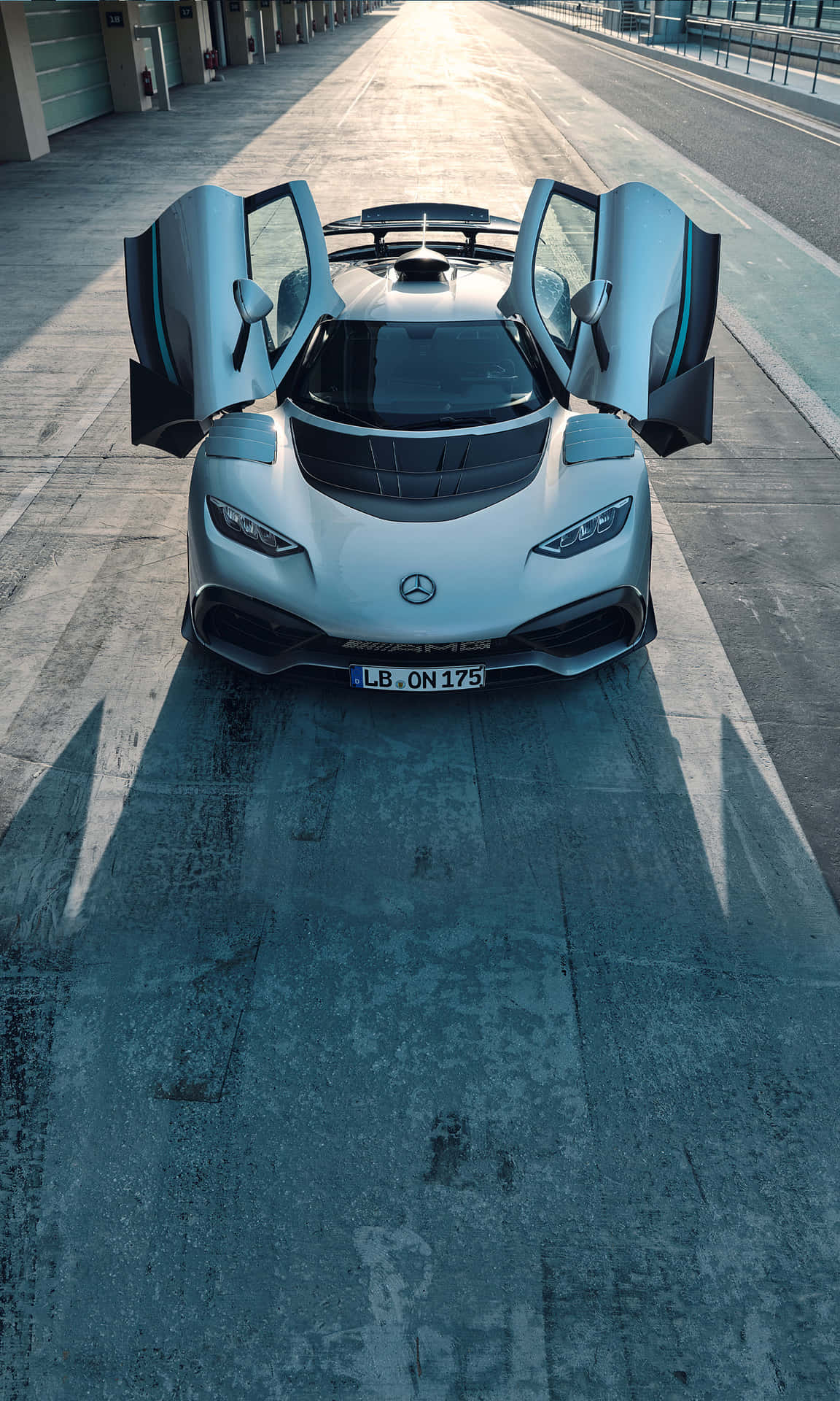 A White Sports Car With Its Doors Open Background