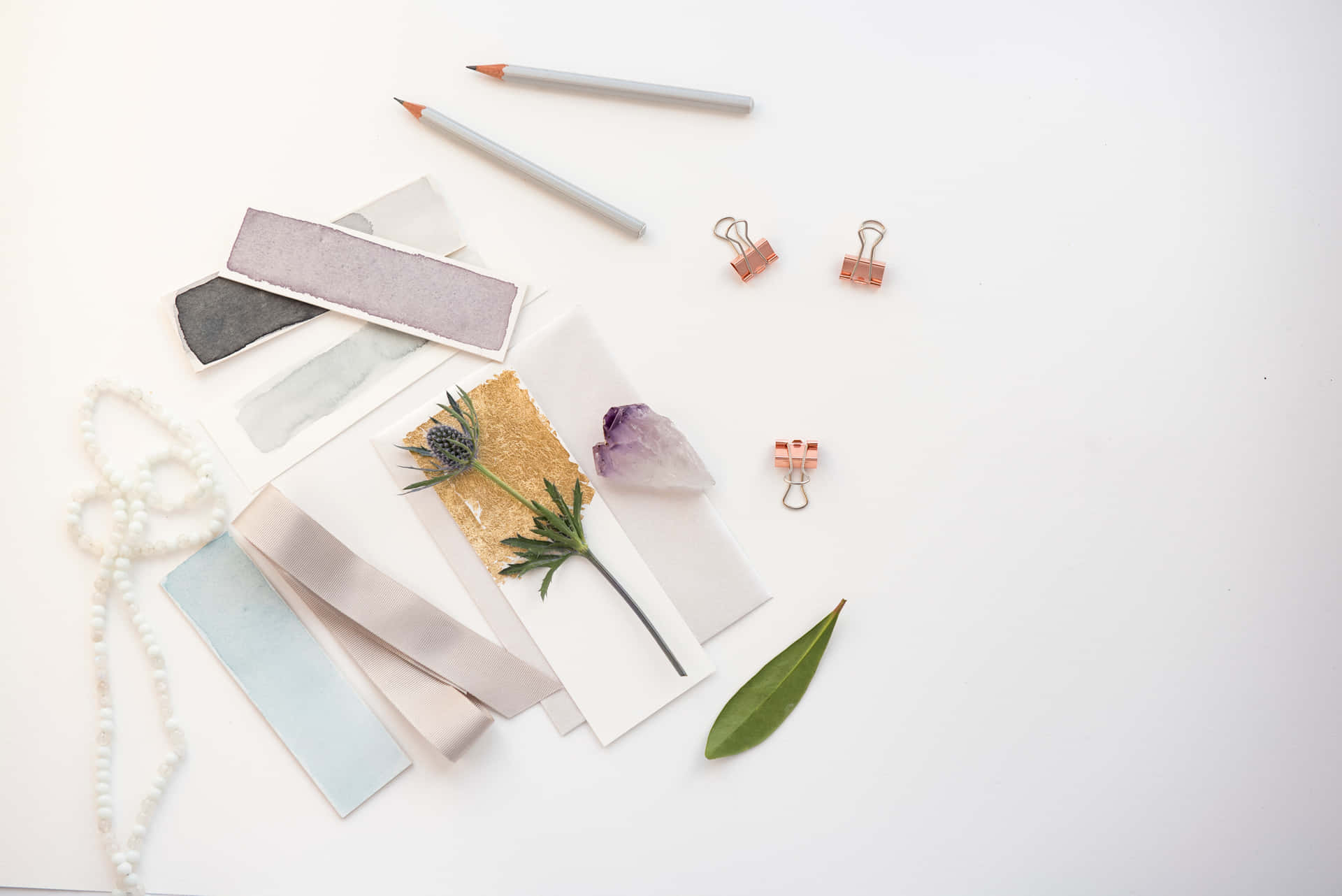 A White Table With Various Items On It Background