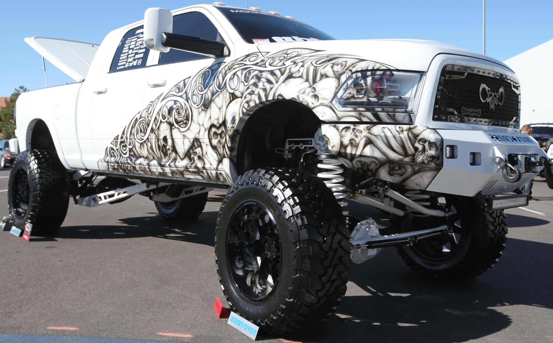 A White Truck With A Large Hood