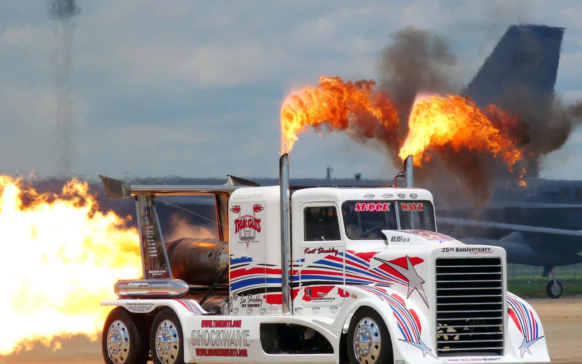 A White Truck With Flames Background