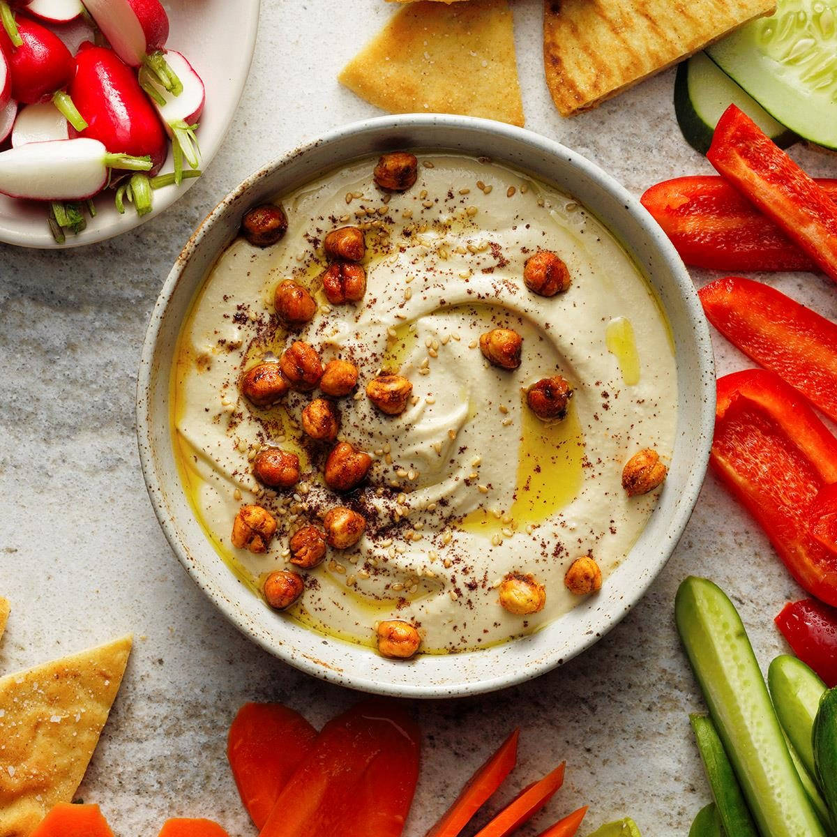 A Wholesome Bowl Of Hummus Topped With Nutritious Brown Chickpeas. Background