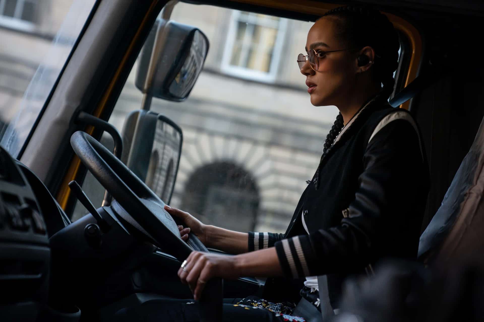 A Woman Driving A Truck Background