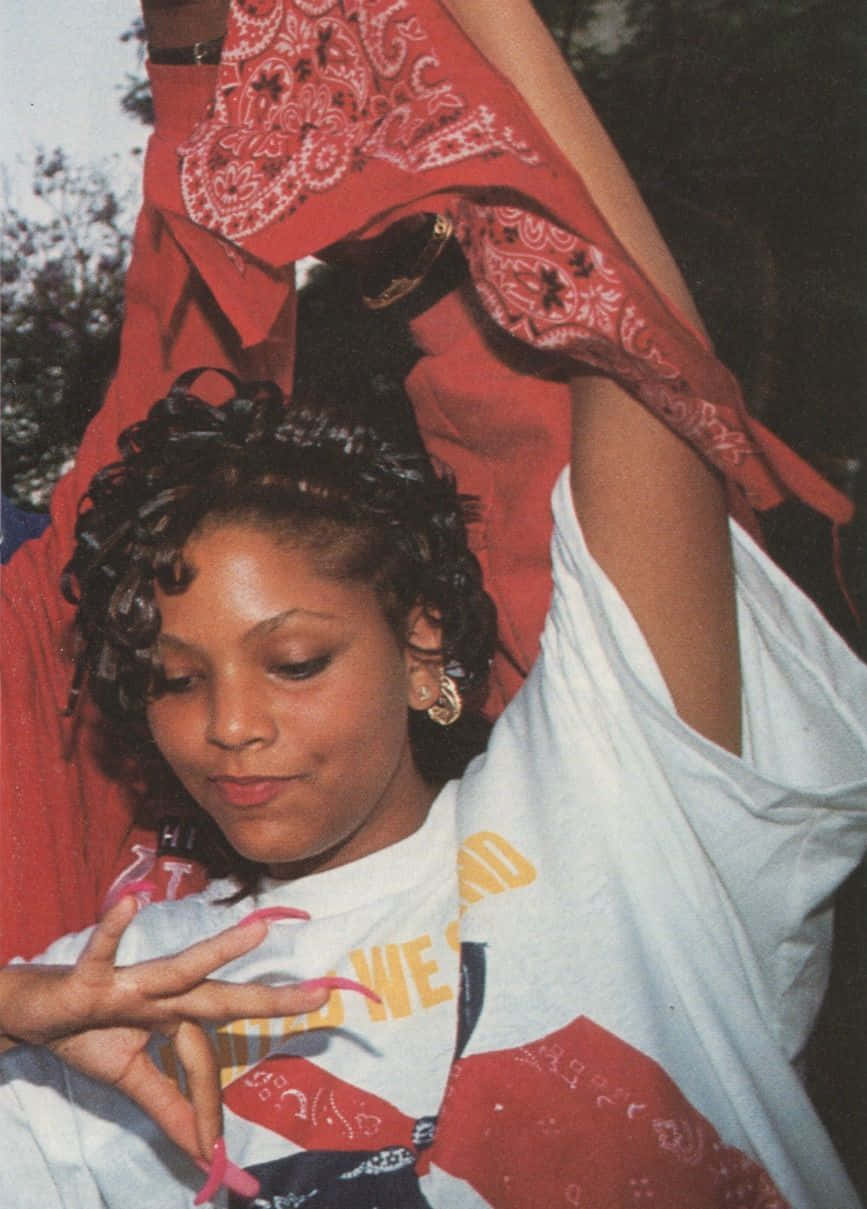 A Woman Holding A Red Bandana Background