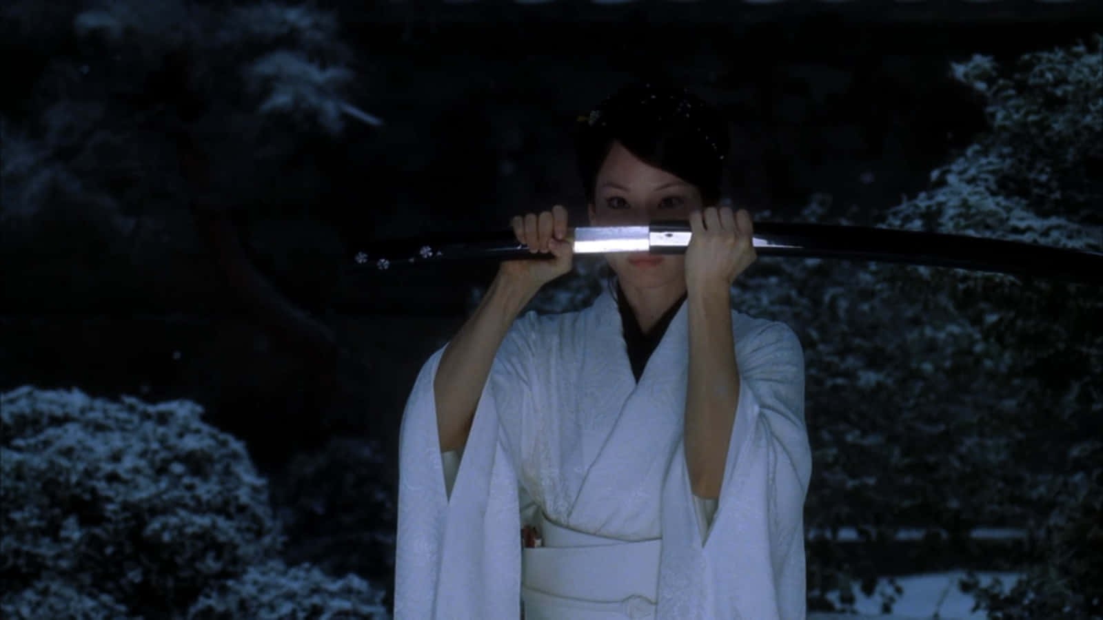 A Woman In A White Robe Holding A Sword Background