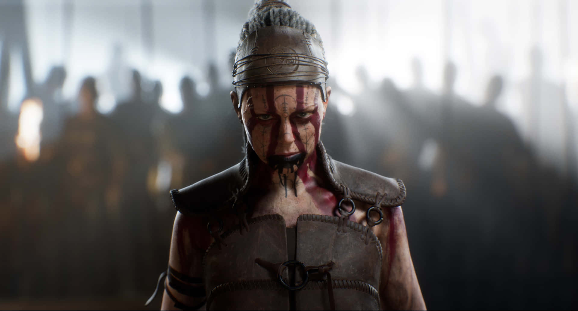 A Woman In Armor With A Sword In Front Of A Crowd Background