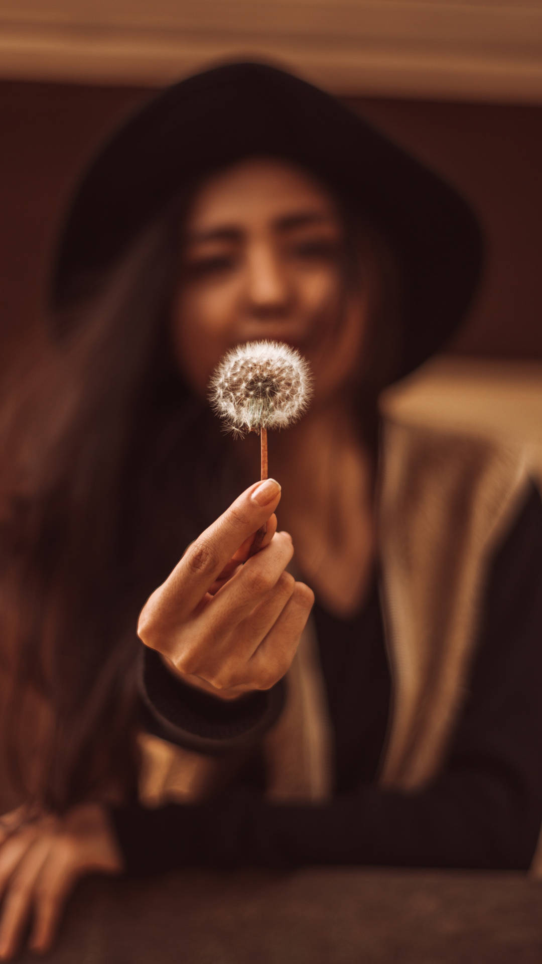 A Woman's Hand Delicately Holding A Pristine White Flower, Shot Against A Bokeh Background, Perfect For Your Iphone Wallpaper. Background