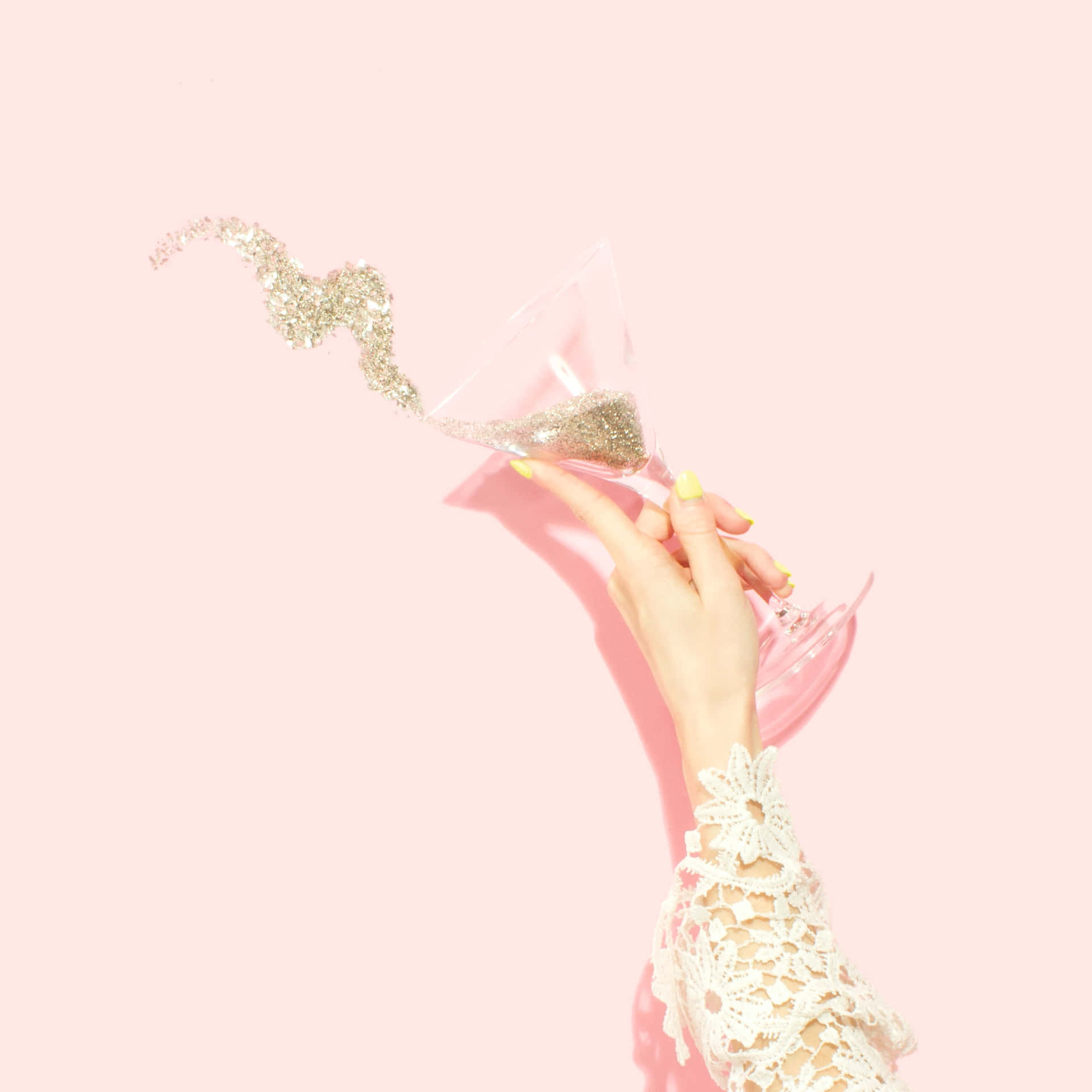 A Woman's Hand Holding A Glass Of Champagne Background