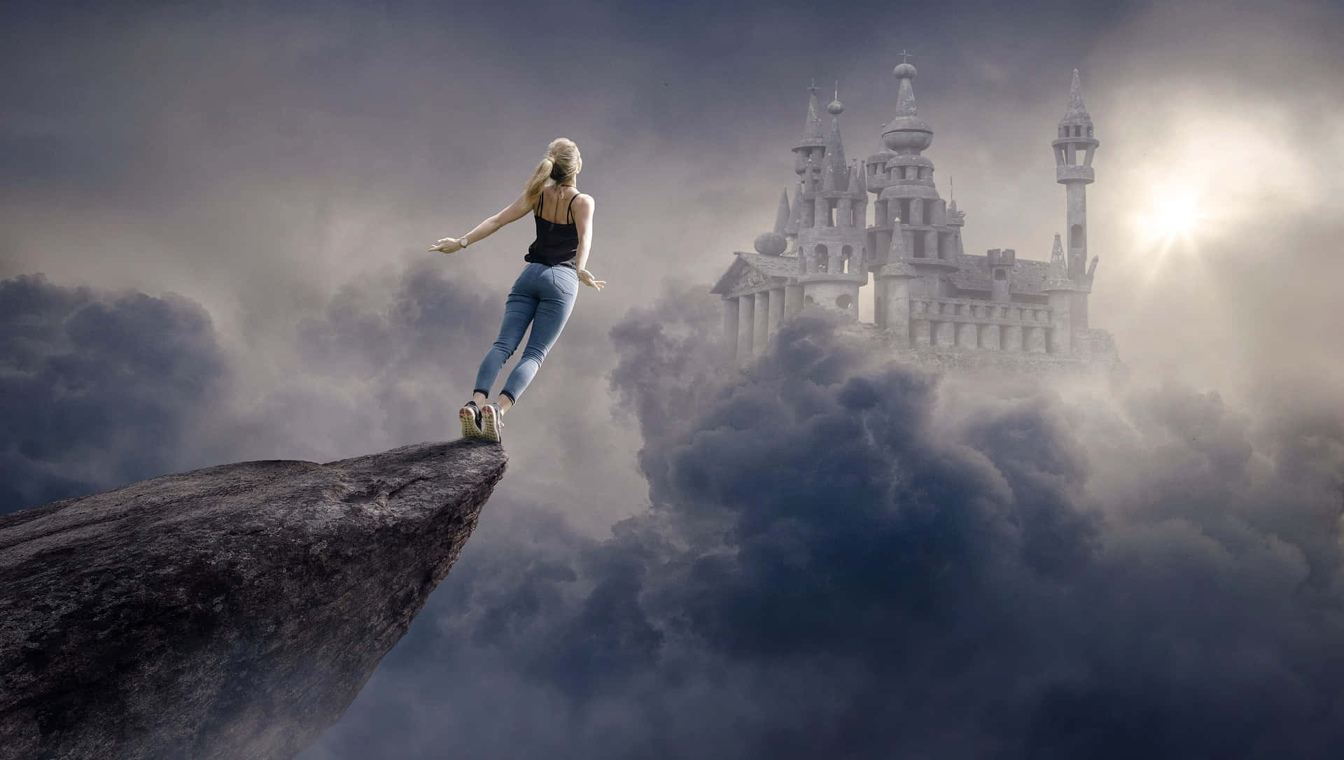 A Woman Standing On A Cliff With A Castle In The Background Background