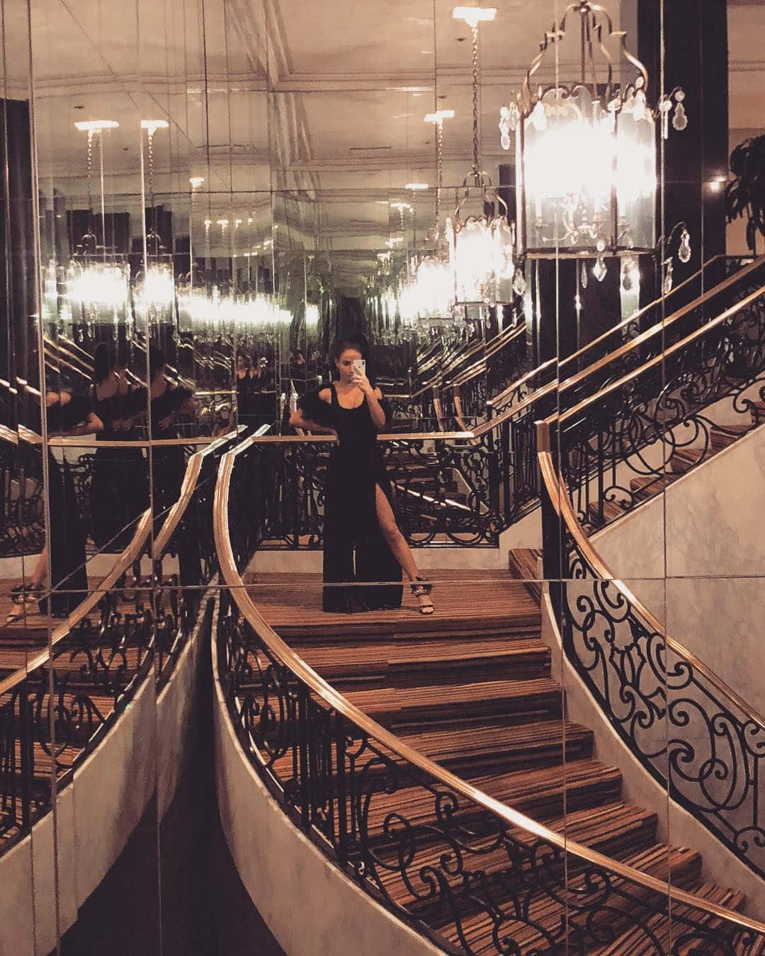 A Woman Standing On A Staircase Background