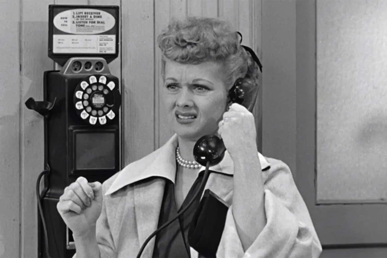 A Woman Talking On A Telephone Background