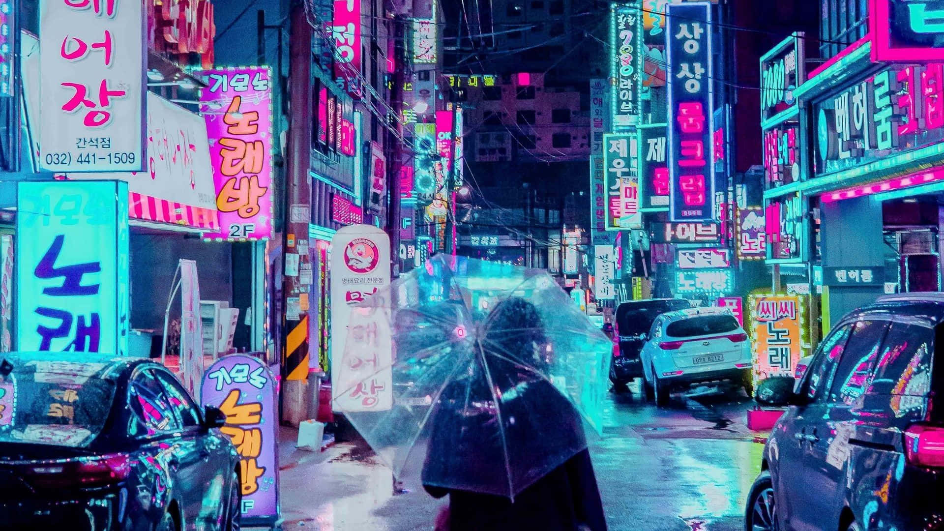 A Woman Walking Down A Street With Neon Signs Background