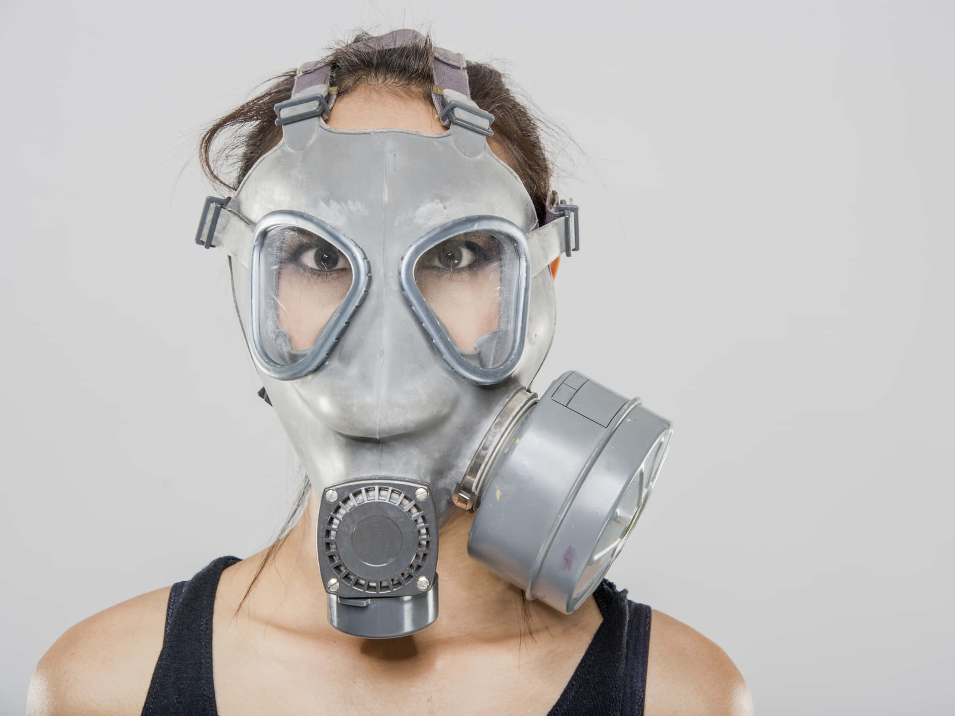 A Woman Wearing A Gas Mask